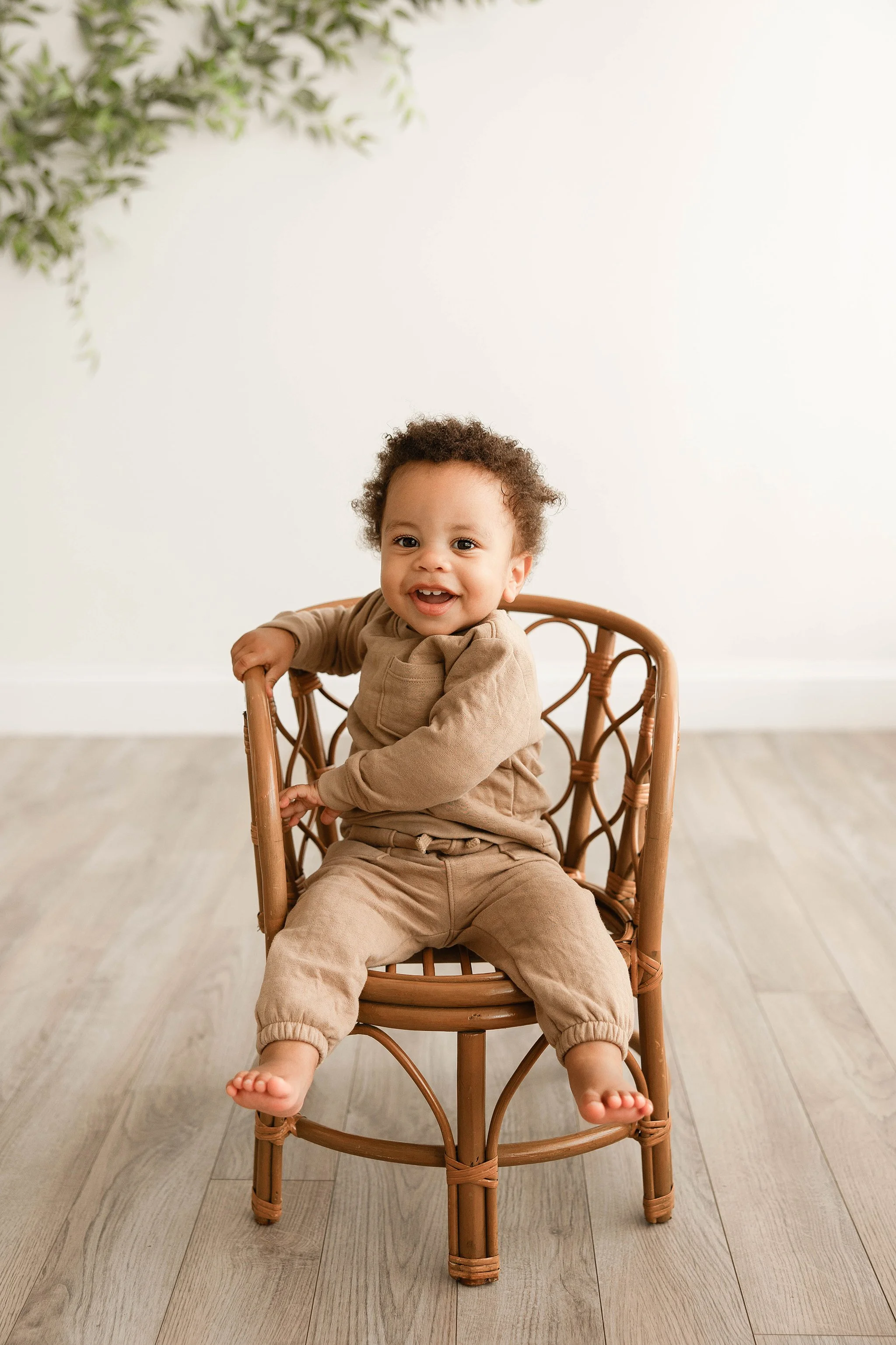 simple first birthday milestone portrait baby boy sitting studio