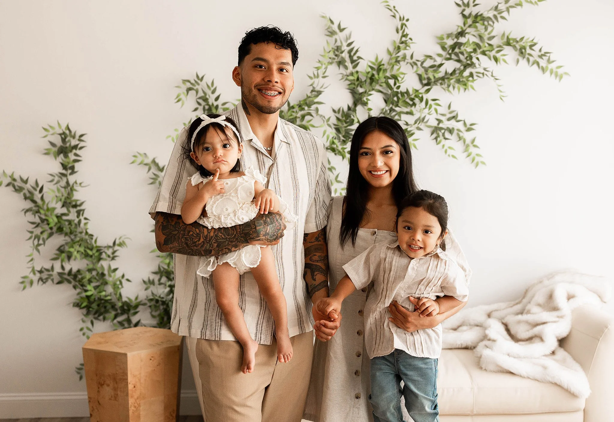 mother and father with baby first birthday timeless portrait