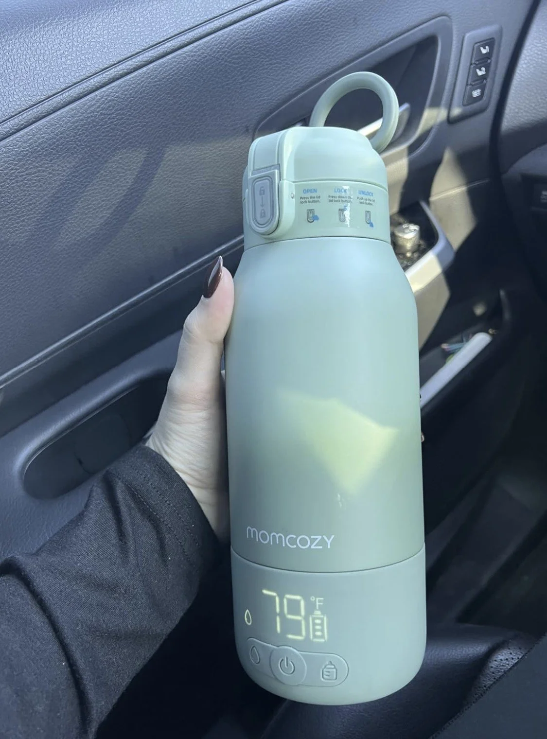 a new baby product by Momcozy that is a portable bottle warmer