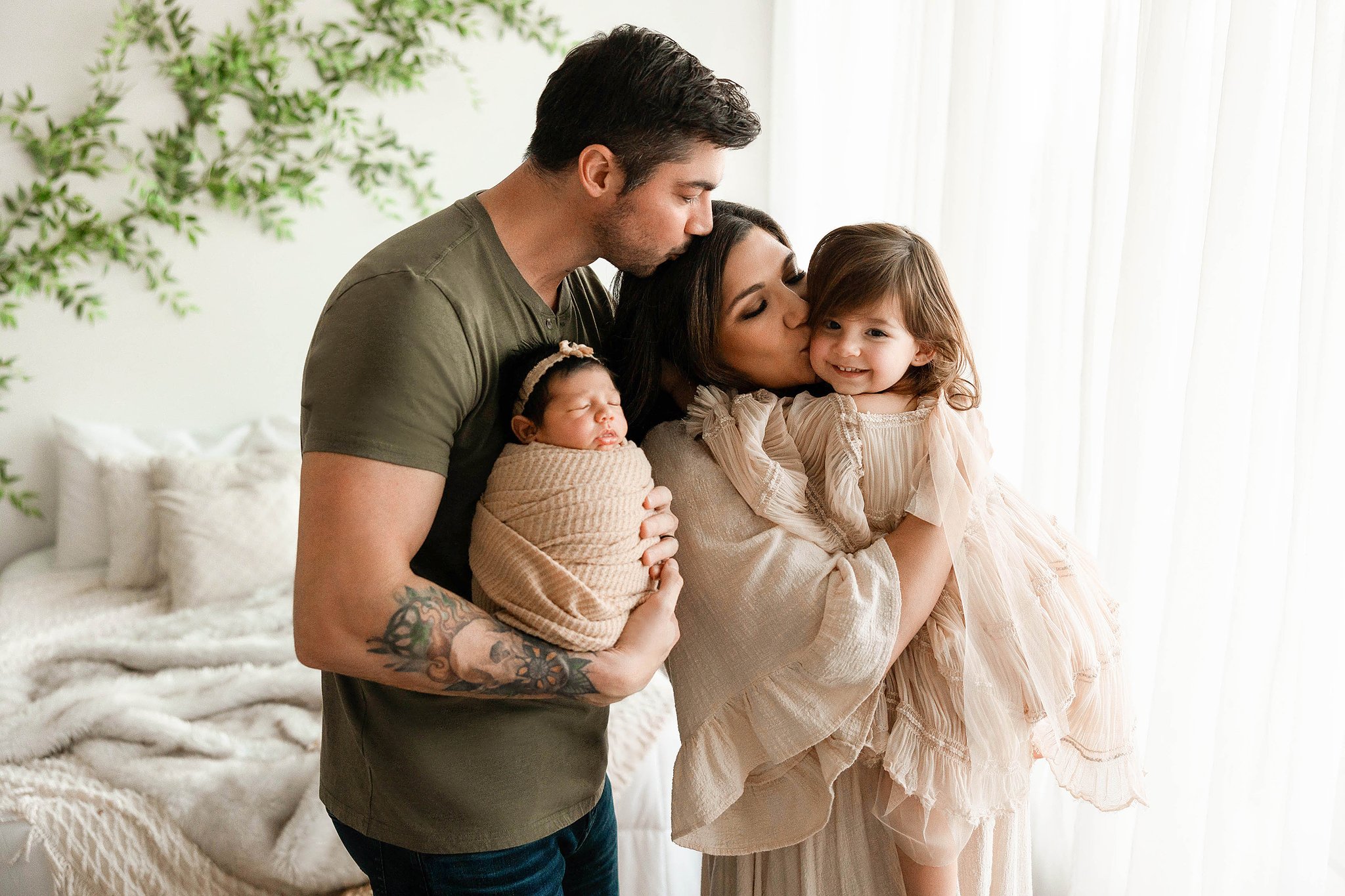 family newborn photo in a natural light studio