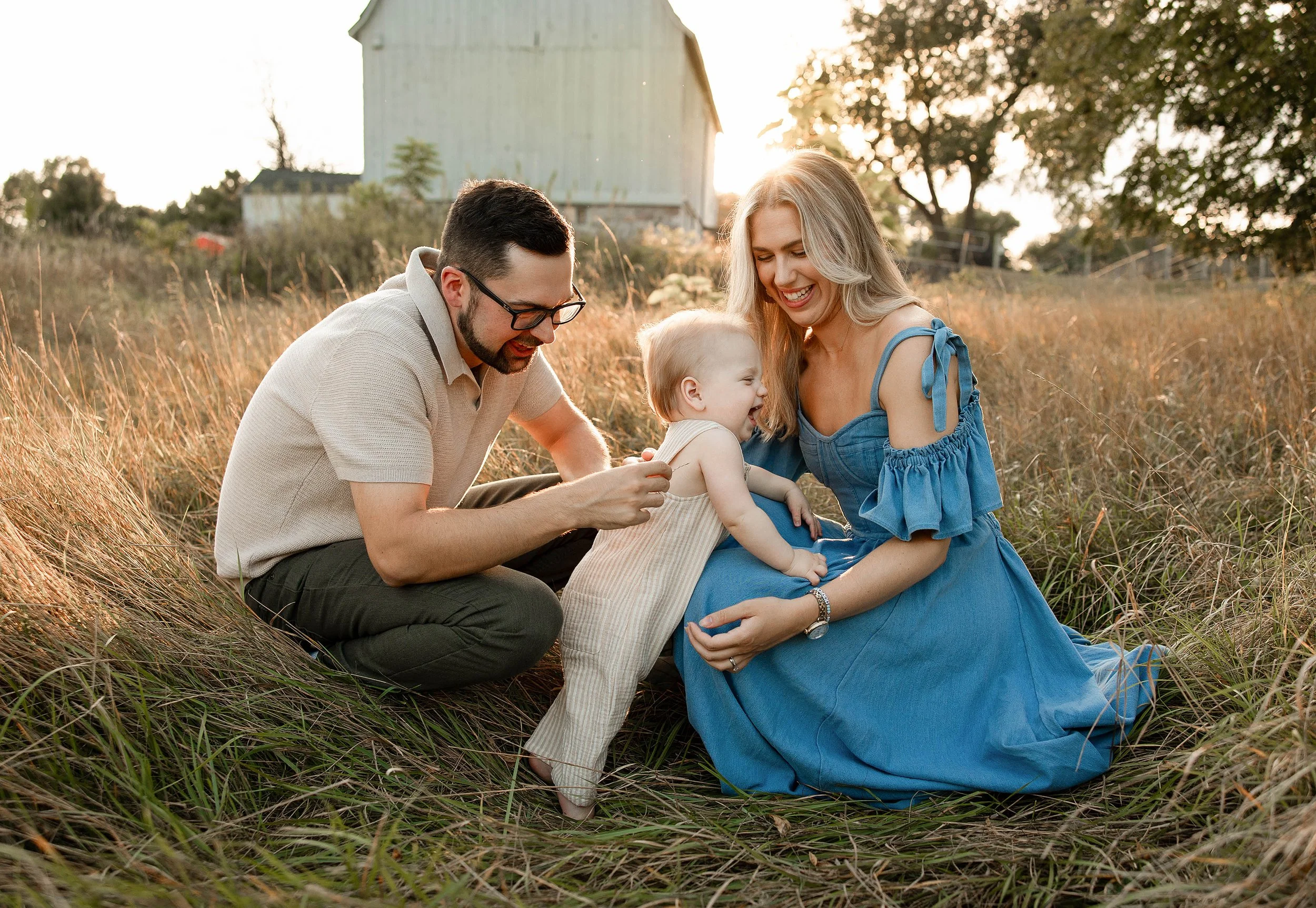 Family wearing coordinated fall outfits for outdoor pictures