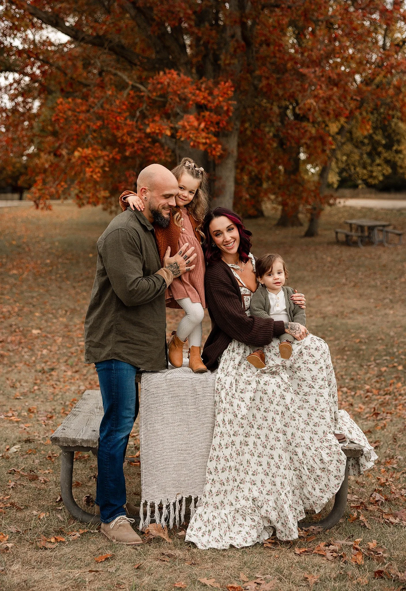 Metro Detroit family wearing coordinated fall outfits during an outdoor family photography session