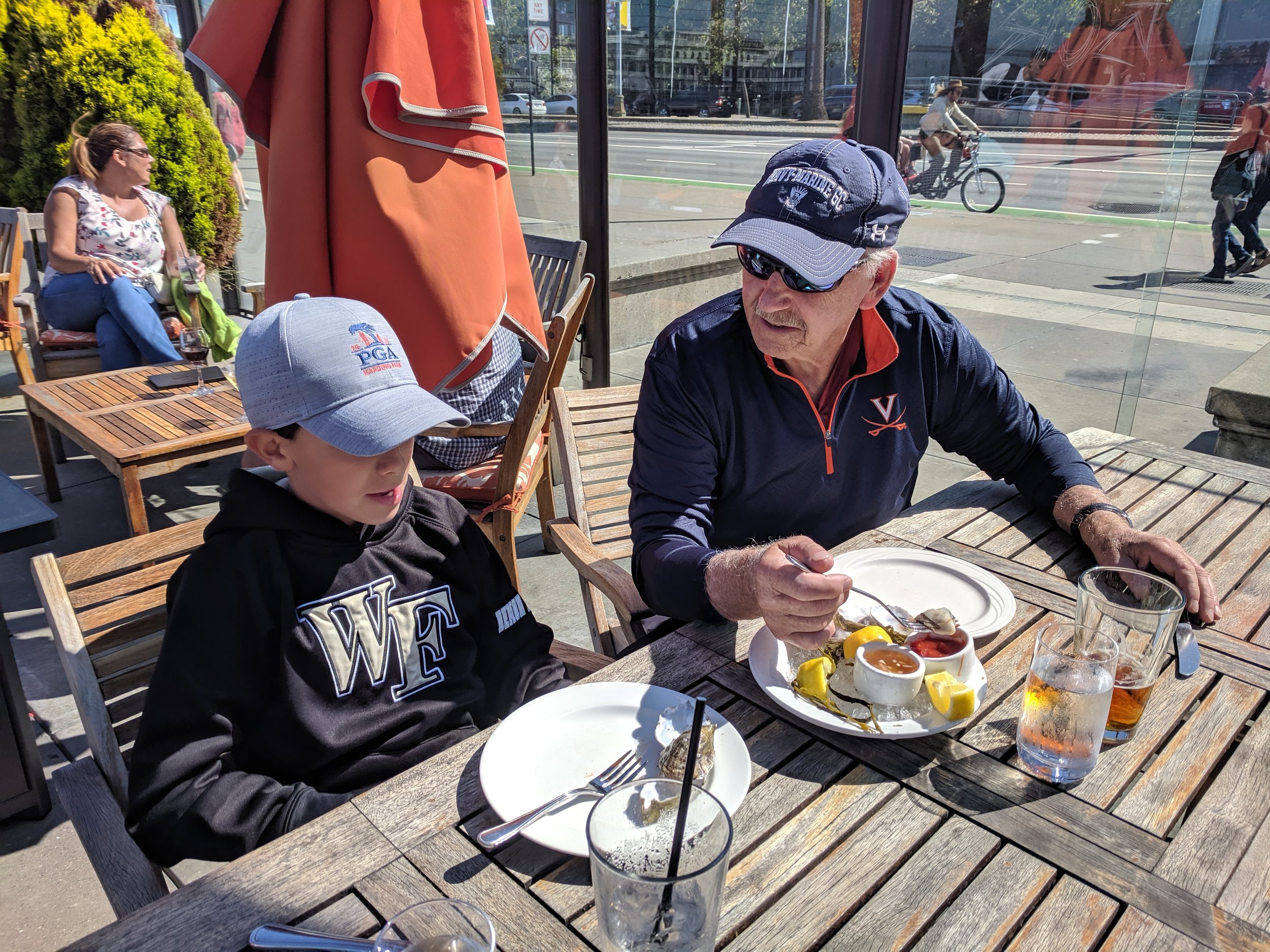  Jackson and Grumpy sharing some oysters along the Embarcadero in San Francisco. 
