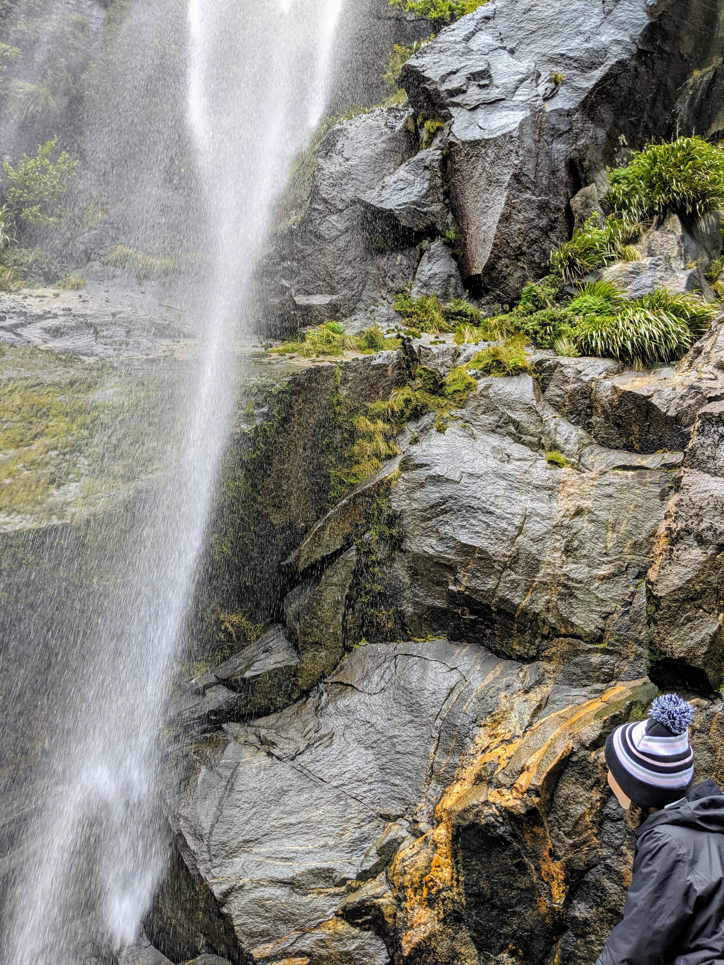  Ada checking out a waterfall and copper deposits in Milford Sound. 