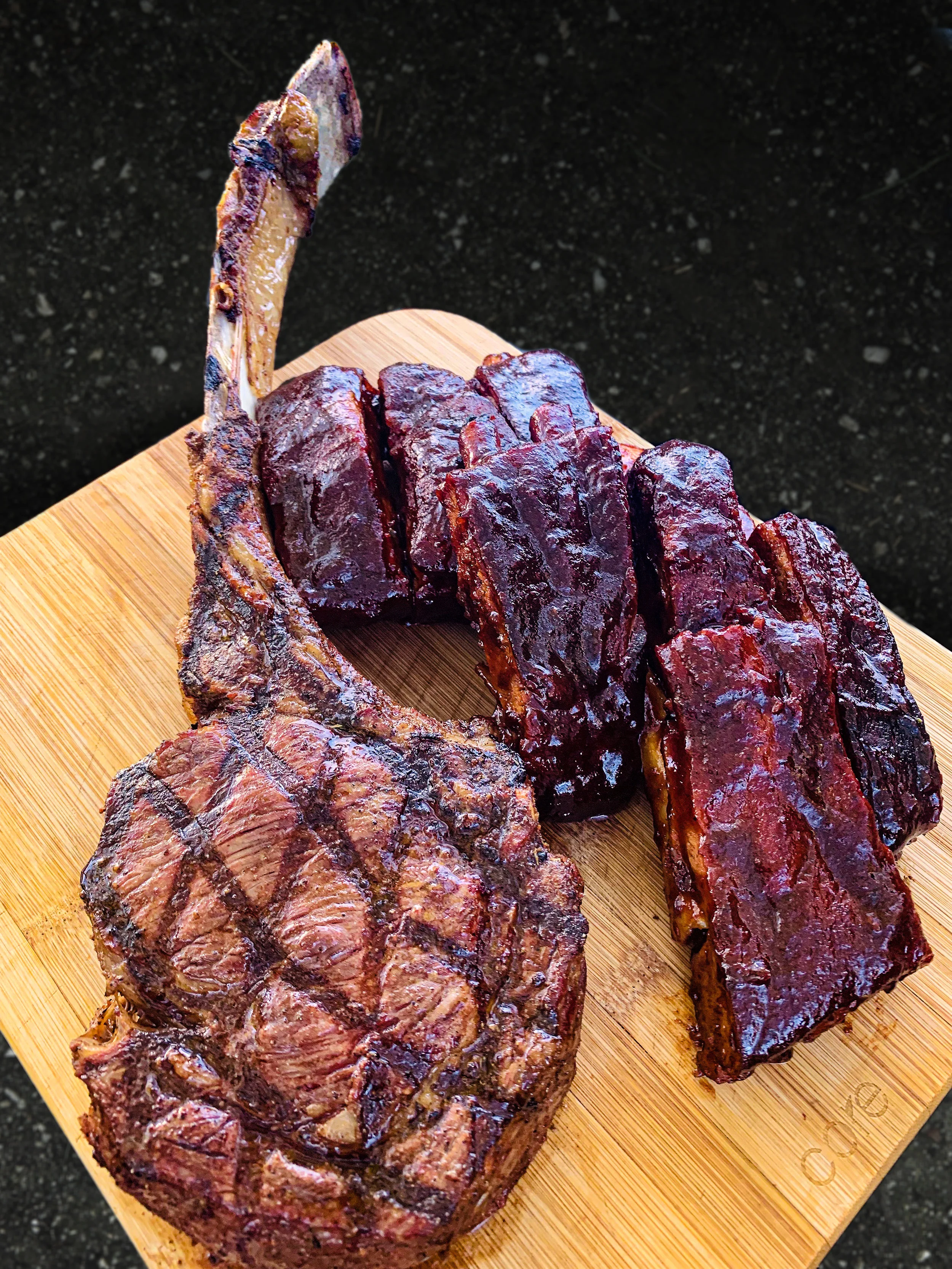 Grilled tomahawk steak and competition style ribs.jpg