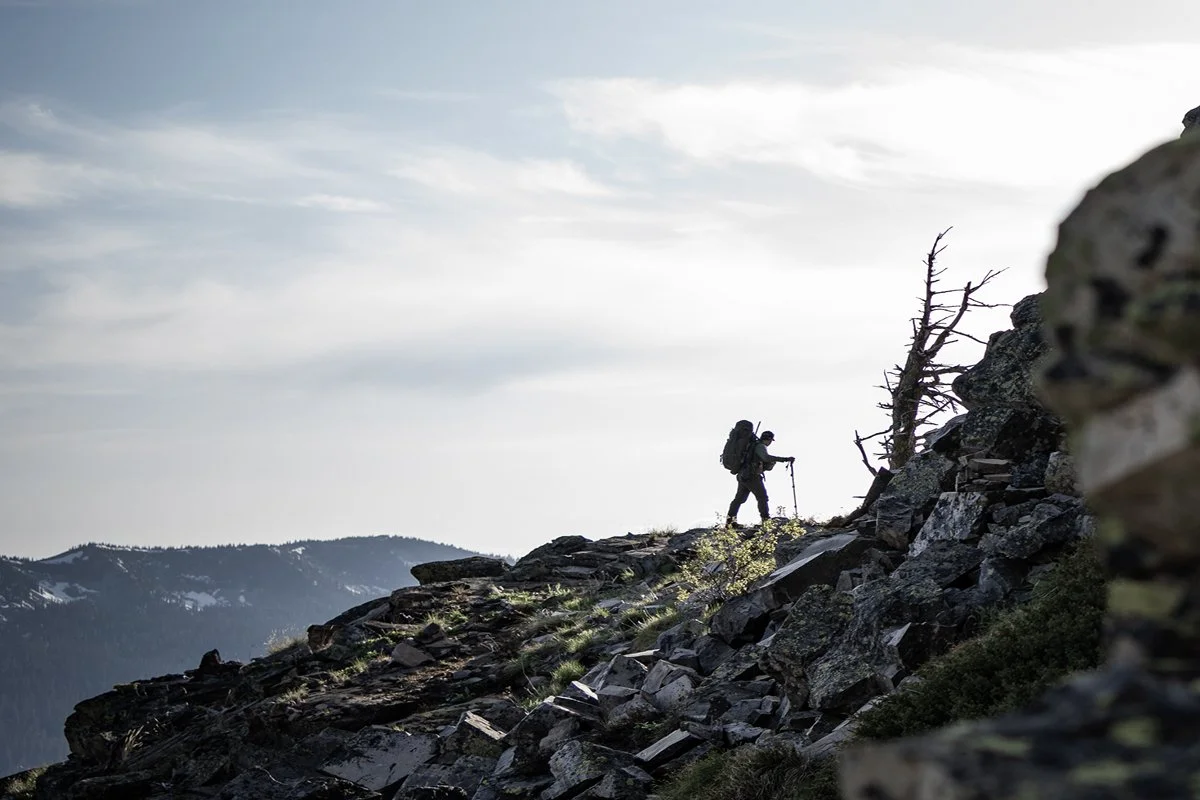 A man hiking up a mountain