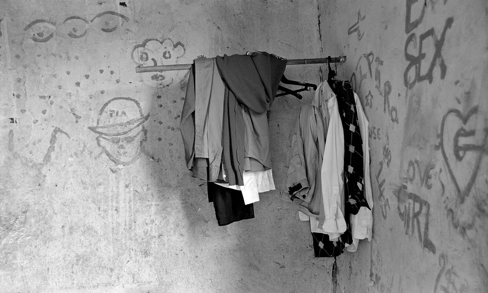  Mkansi household, bedroom with graffiti and the clothes of their late parents/ 2007 