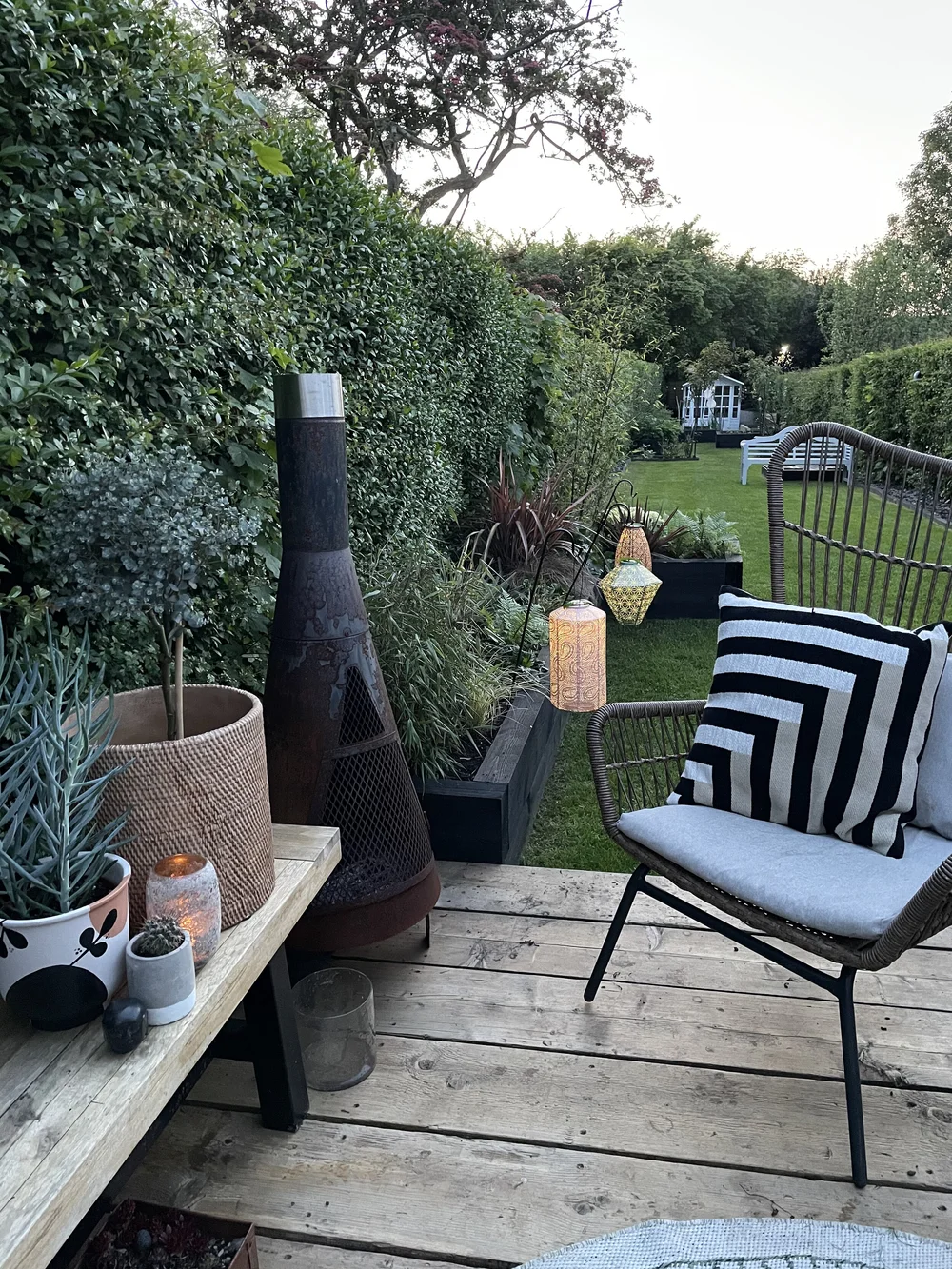 2nd bed with lanterns and chair view.jpeg