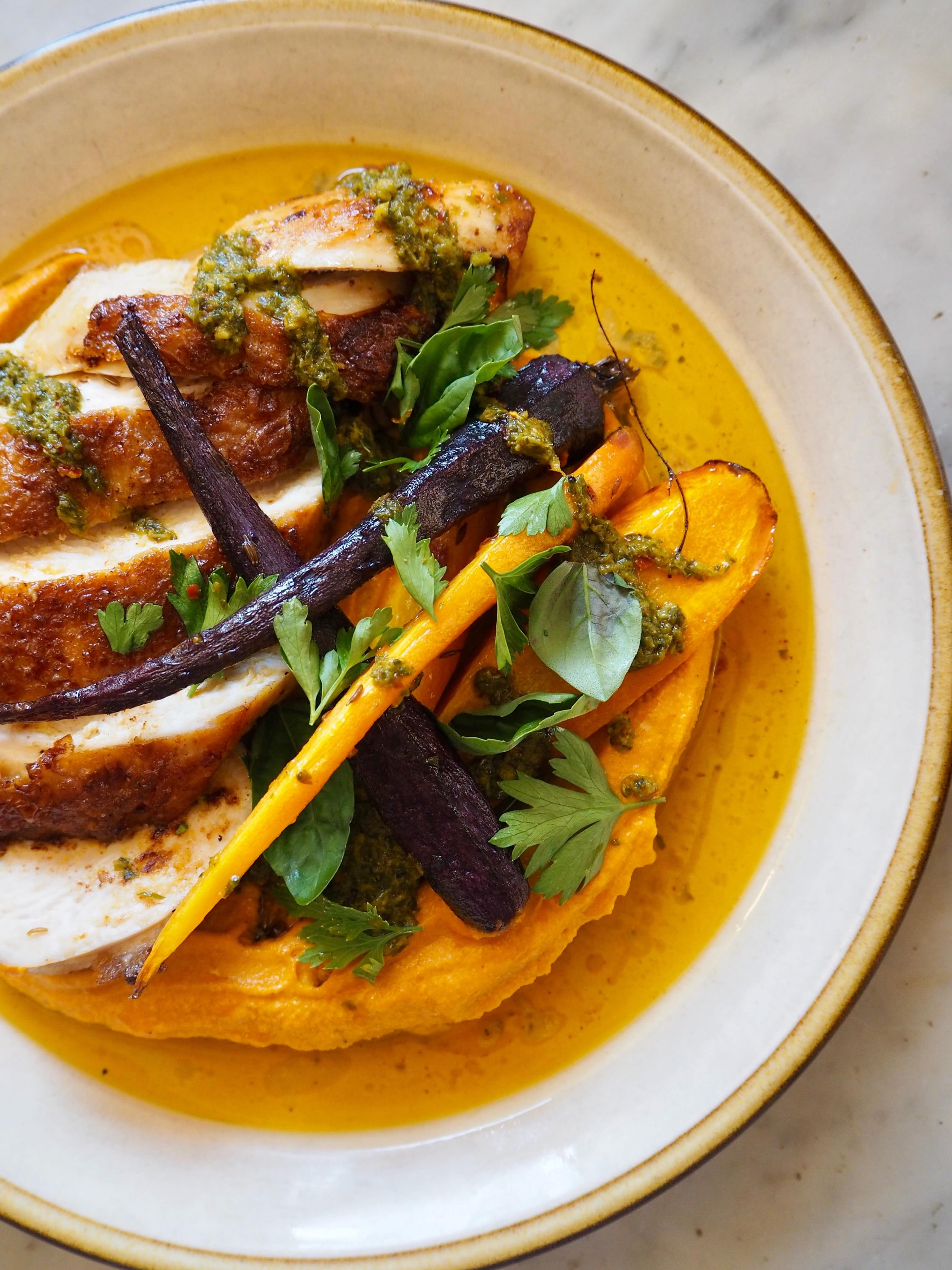 Chicken breast, squash and cashew nut romesco, spiced roast carrots, green chermoula. 

Romesco sauce is traditionally made with red peppers. We won&rsquo;t see British ones until later in the summer, so for now, we&rsquo;ve turned to the squash inst