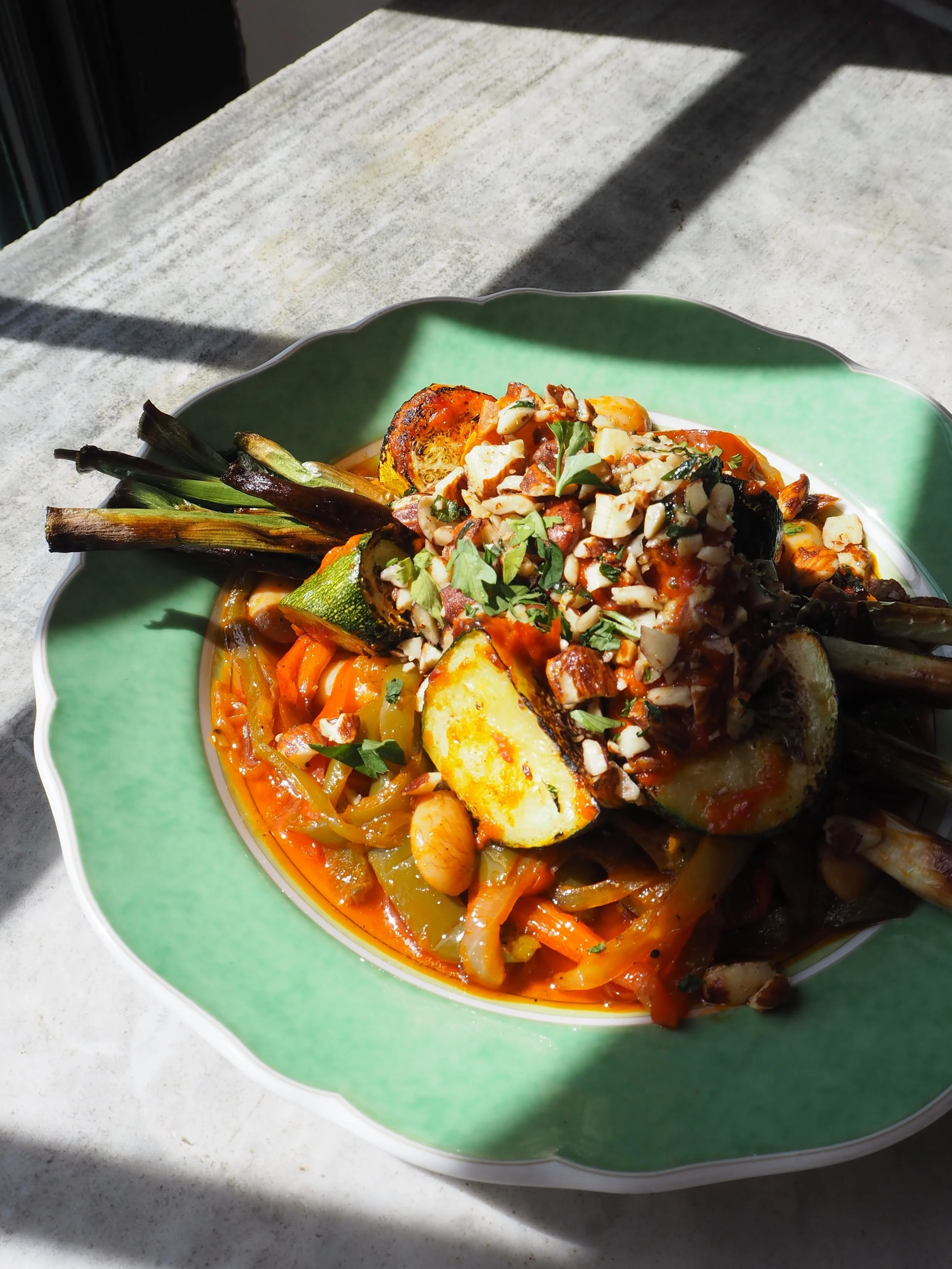 Harissa roasted courgette, butter beans, pepperonis, grilled spring onions, almond picada. 

Local ingredients, Mediterranean flavours.

The courgettes, peppers and spring onions are all from Aidan @greengingerorganics up at Baddaford farm, joined by