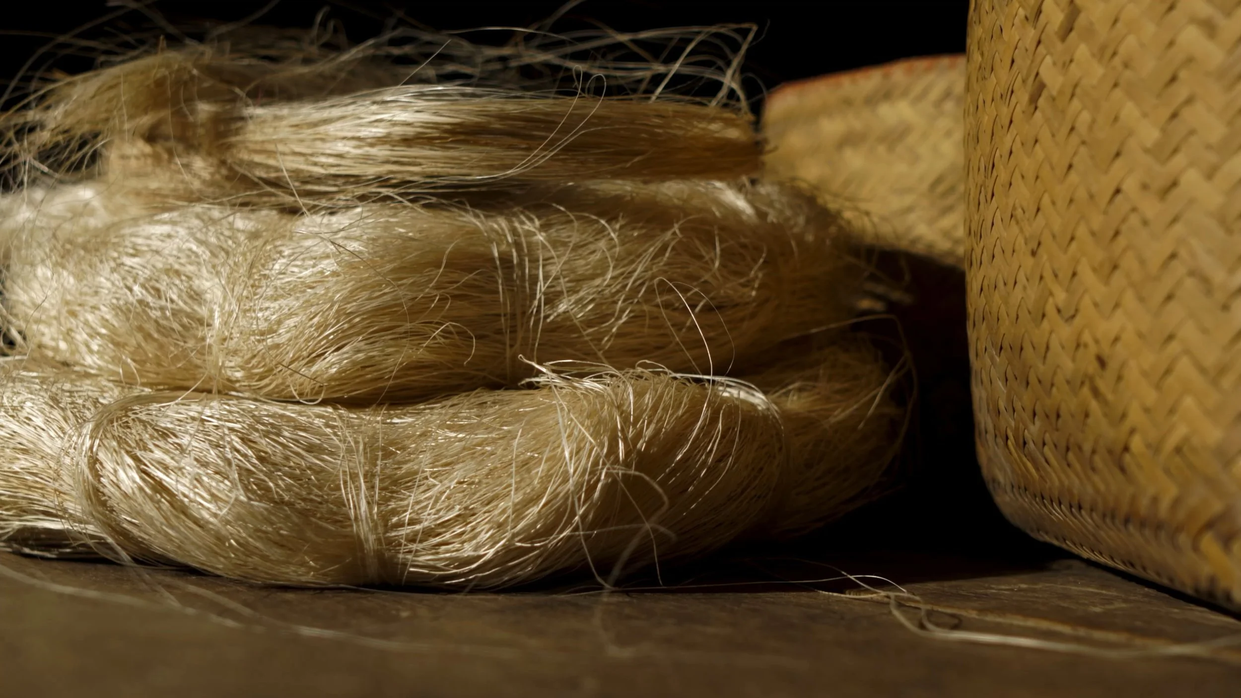 Natural abaca textures for a warm sustainable interior palette.