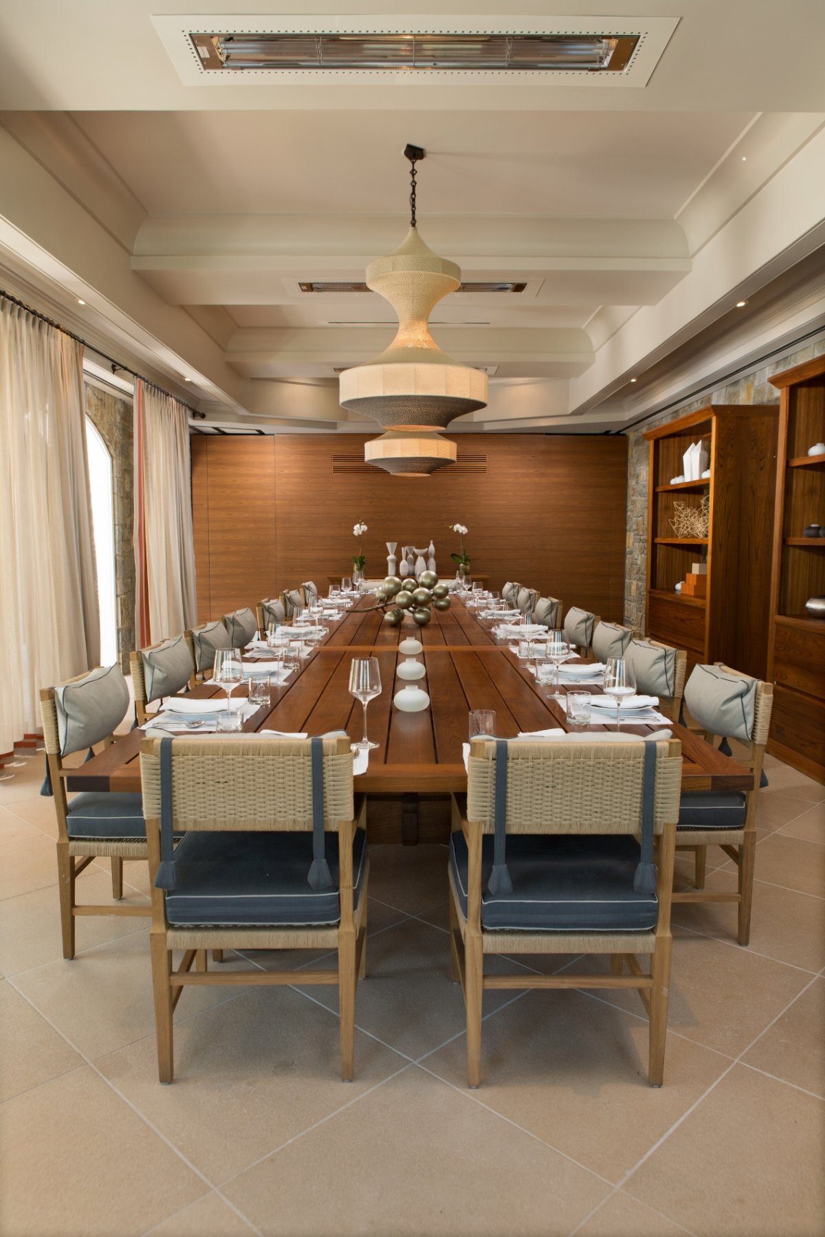 Guest Dining Room with contemporary furnishing, pendant lighting and custom drapery