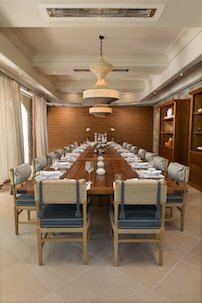 Guest Dining Room with contemporary furnishing, pendant lighting and custom drapery