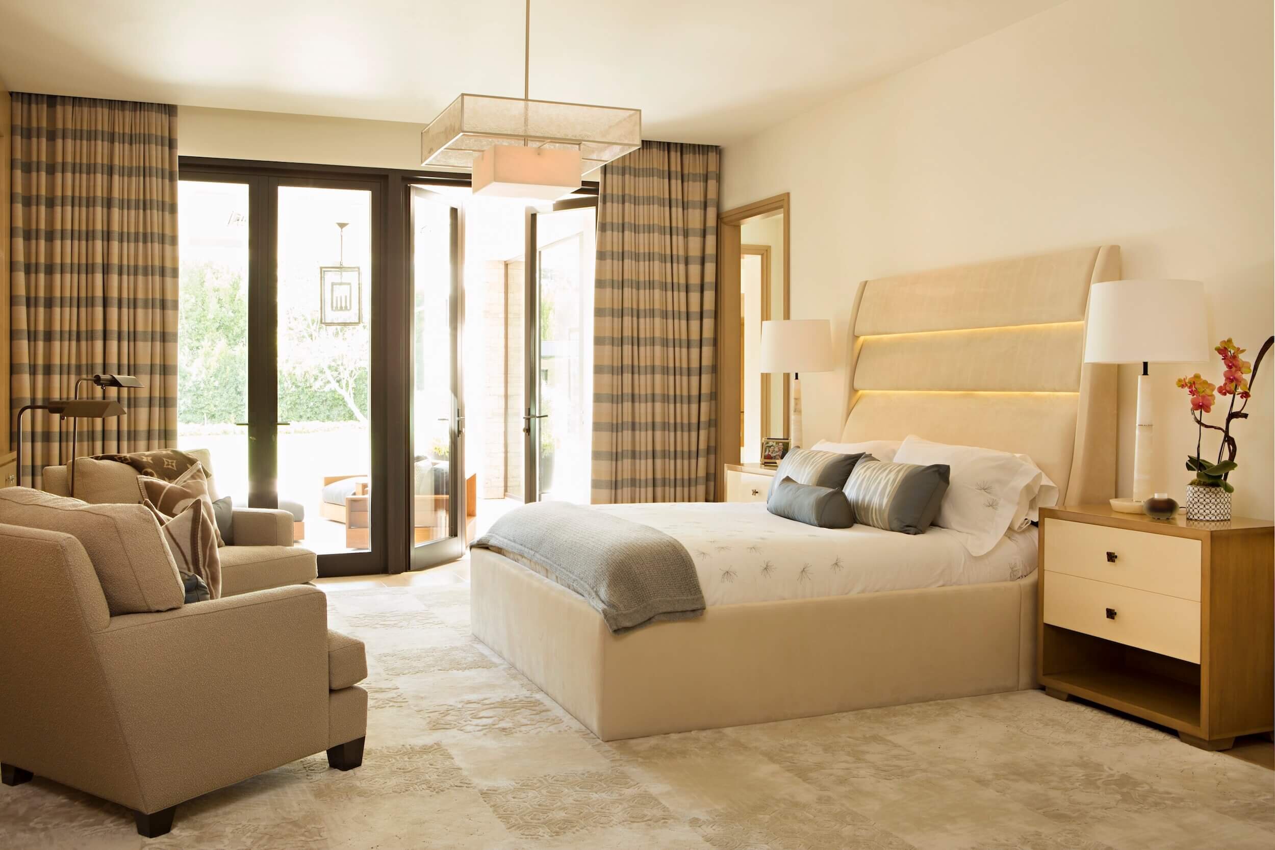 A Master Bedroom with a Pagani Chandlier, custom alpaca drapery and mid-century furnishing