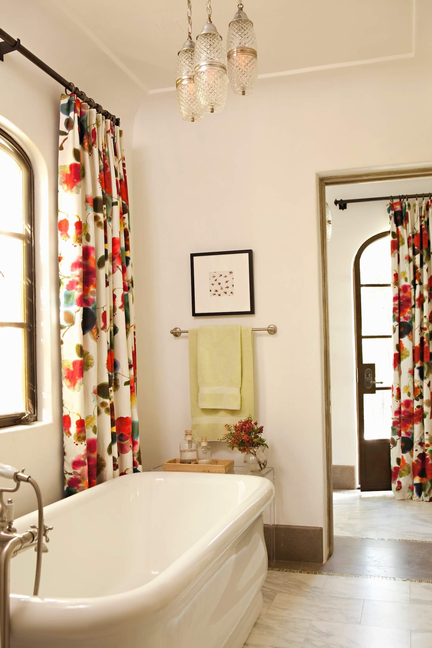 Bathroom with stand alone tub and floral custom drapery