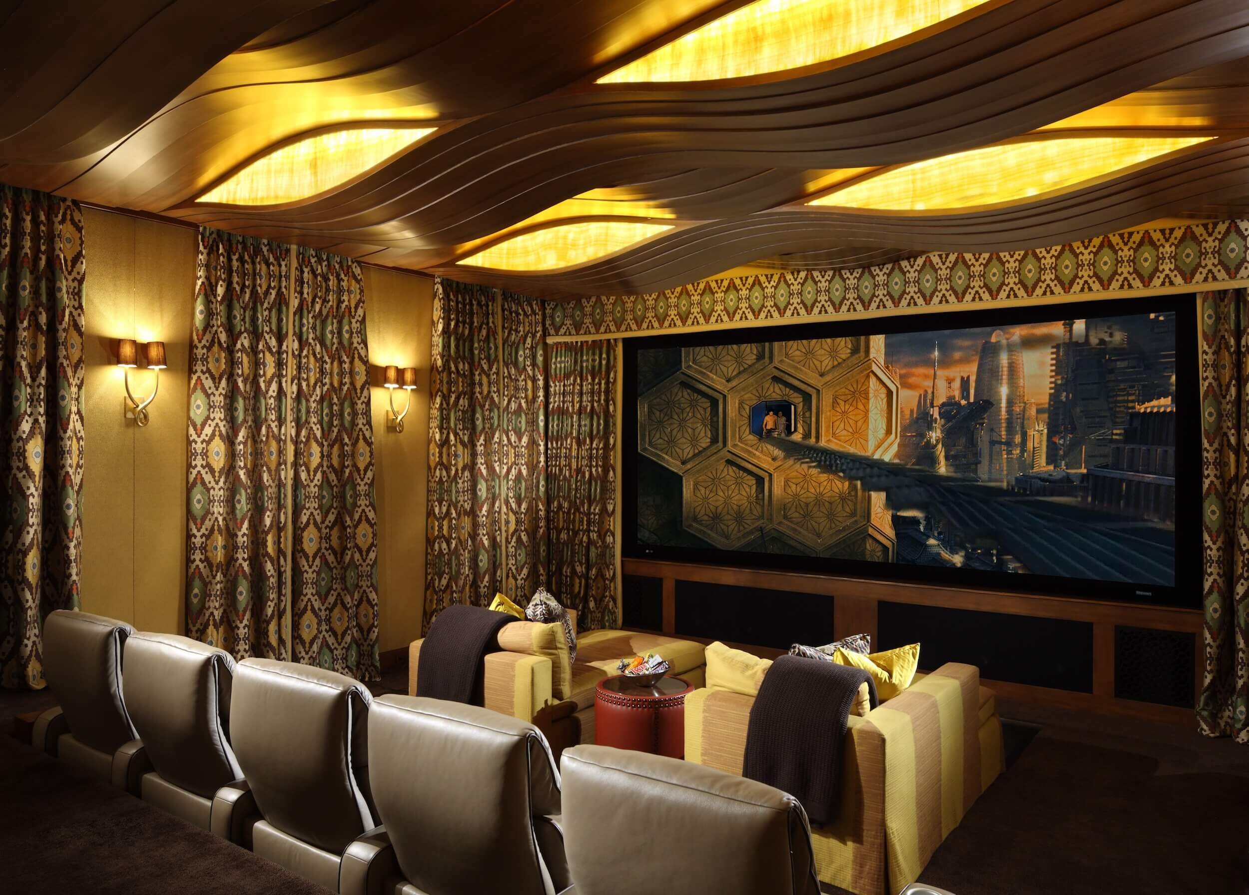 Theater with upholstered walls, leather upholstery seating and custom drapery.