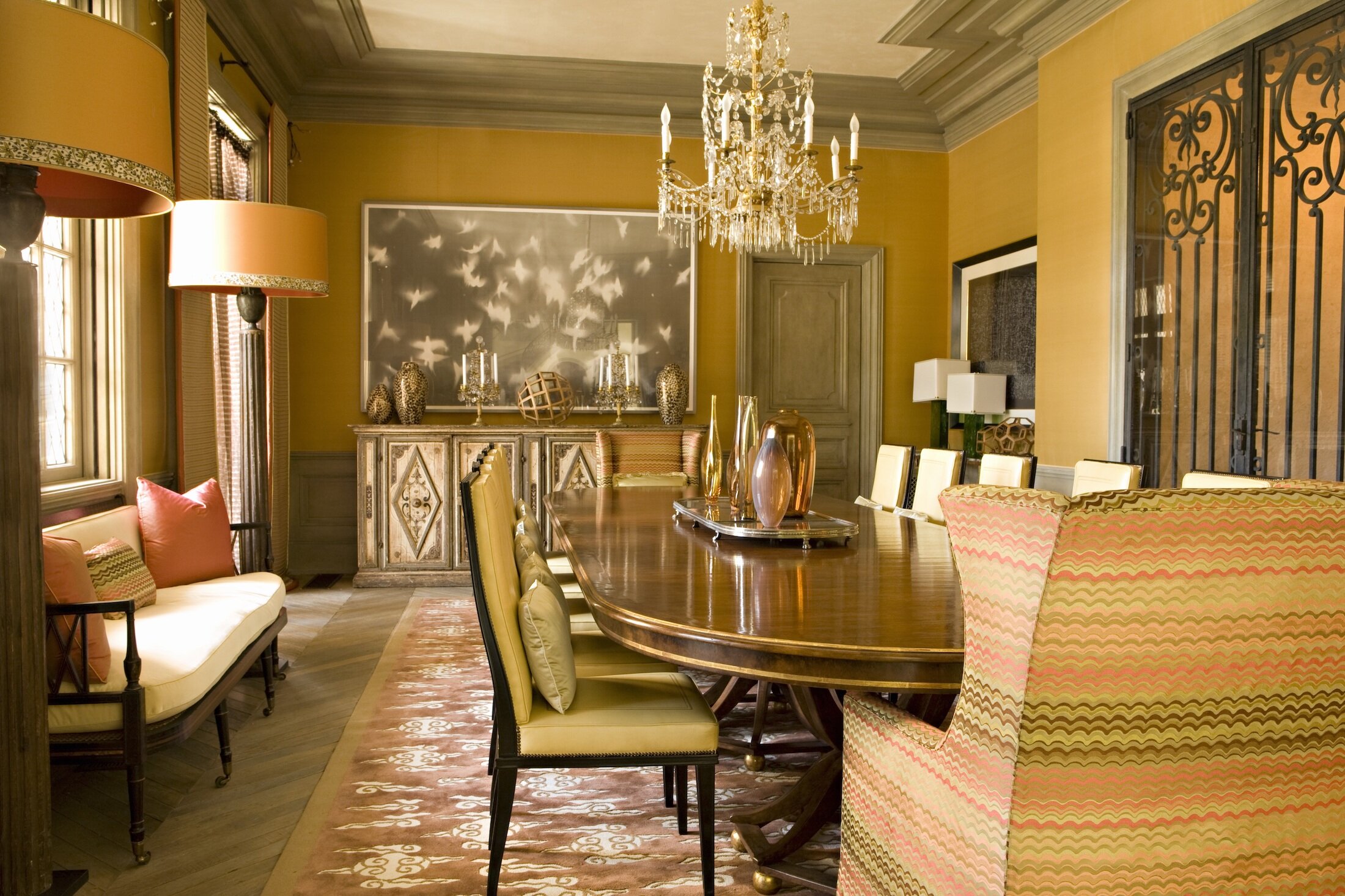 A Formal Dining Room with reclaimed French oak  floors, upholstered  dining chairs and upholstered walls.