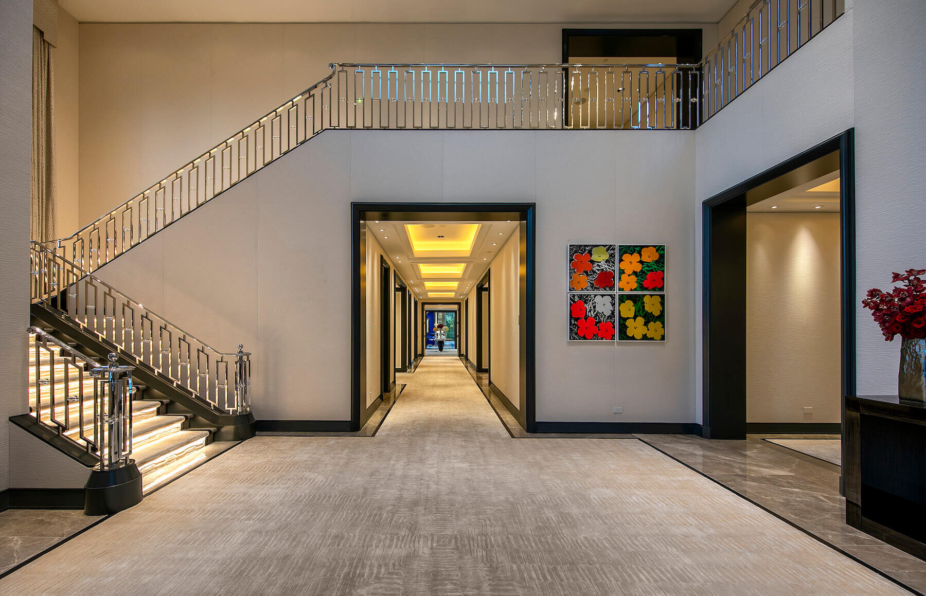 The entry foyer to the estate, filled with wall upholstery and a price art collection.