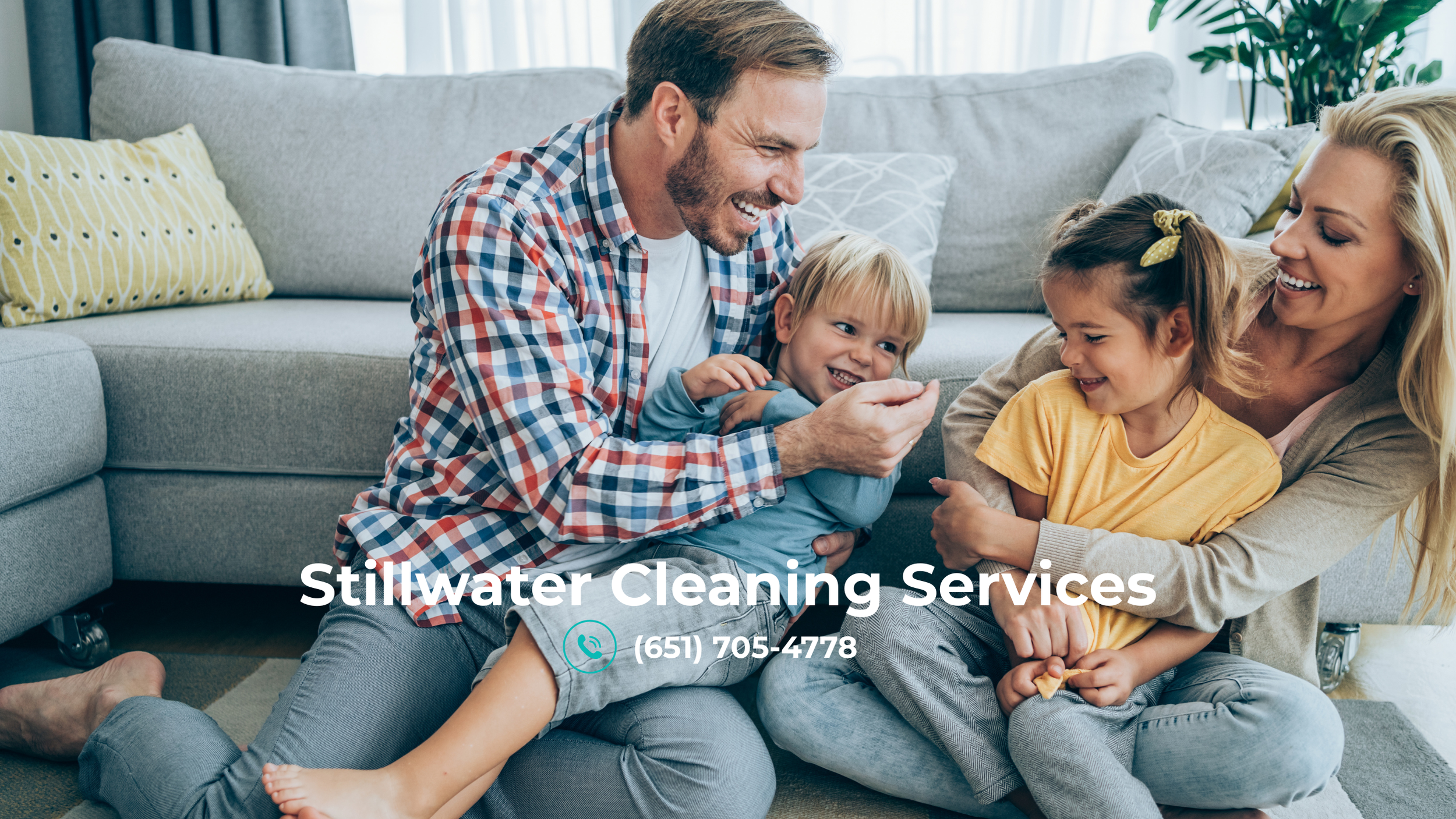 alt="happy family in Stillwater, sitting on the floor"