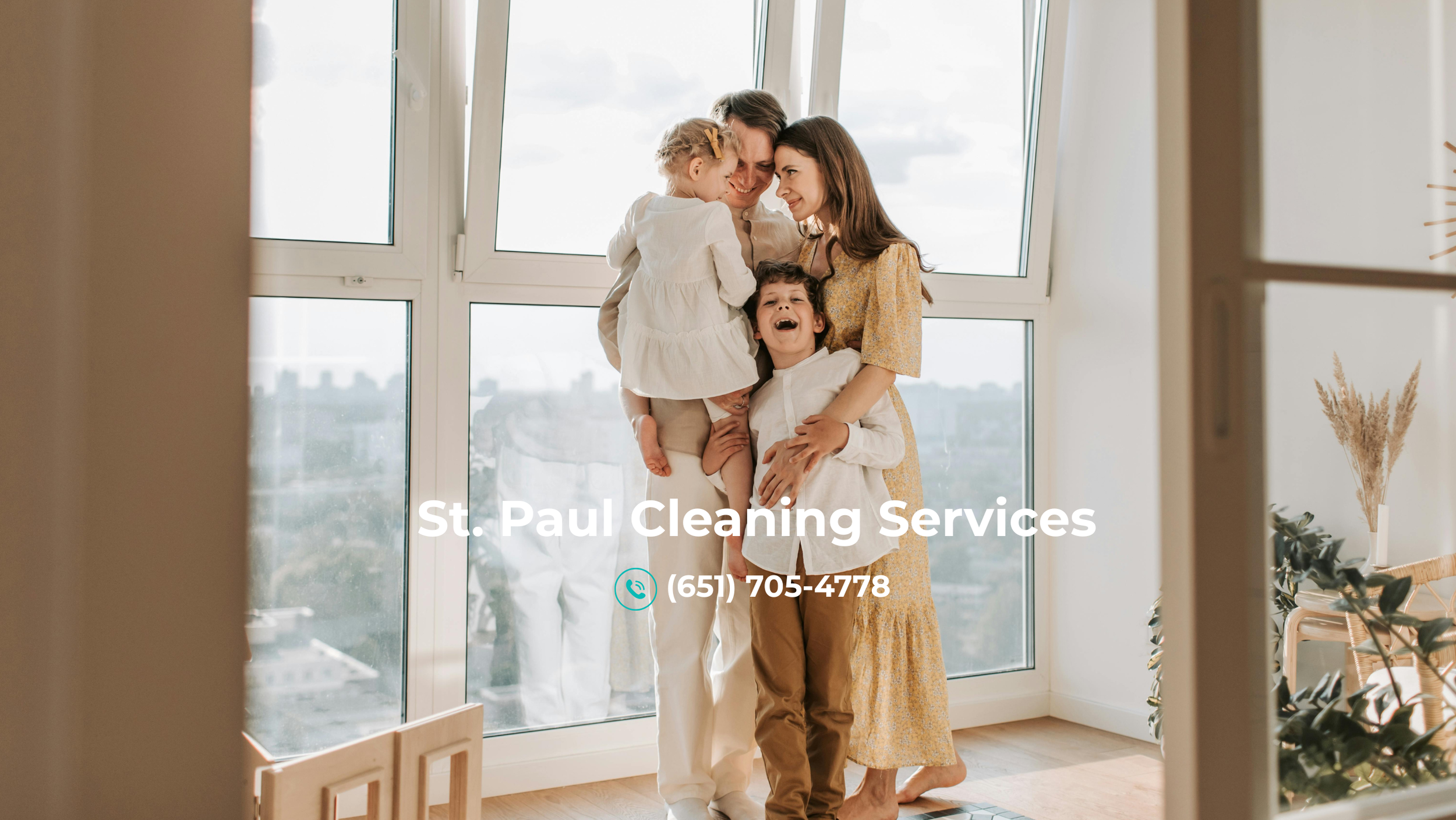 ="happy family standing next to huge windows of their apartment in st paul mn"