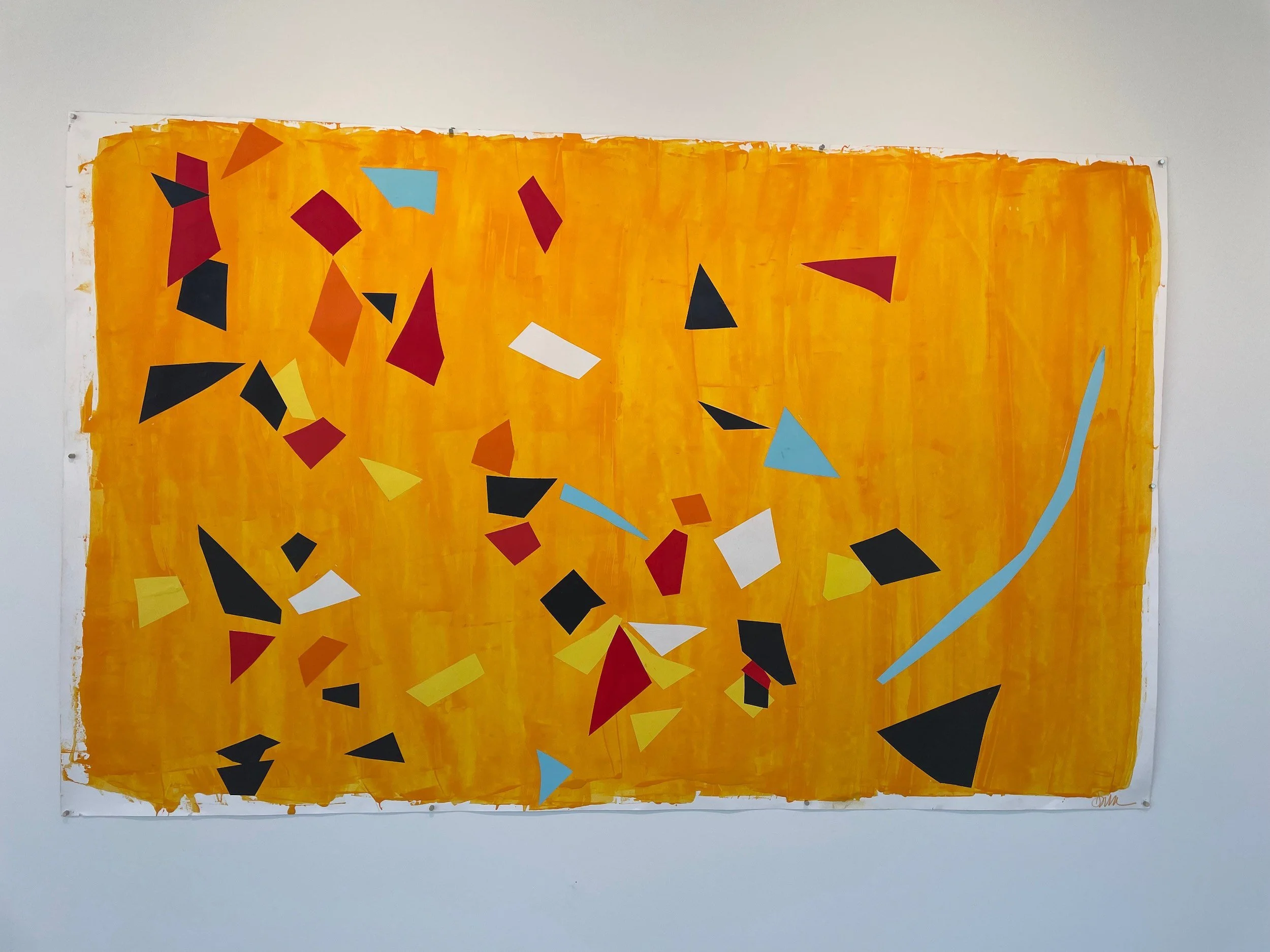 Abstract art with a yellow, orange, and red background featuring various geometric shapes such as triangles, squares, and trapezoids in colors including black, white, blue, and yellow. The shapes appear scattered across the canvas.