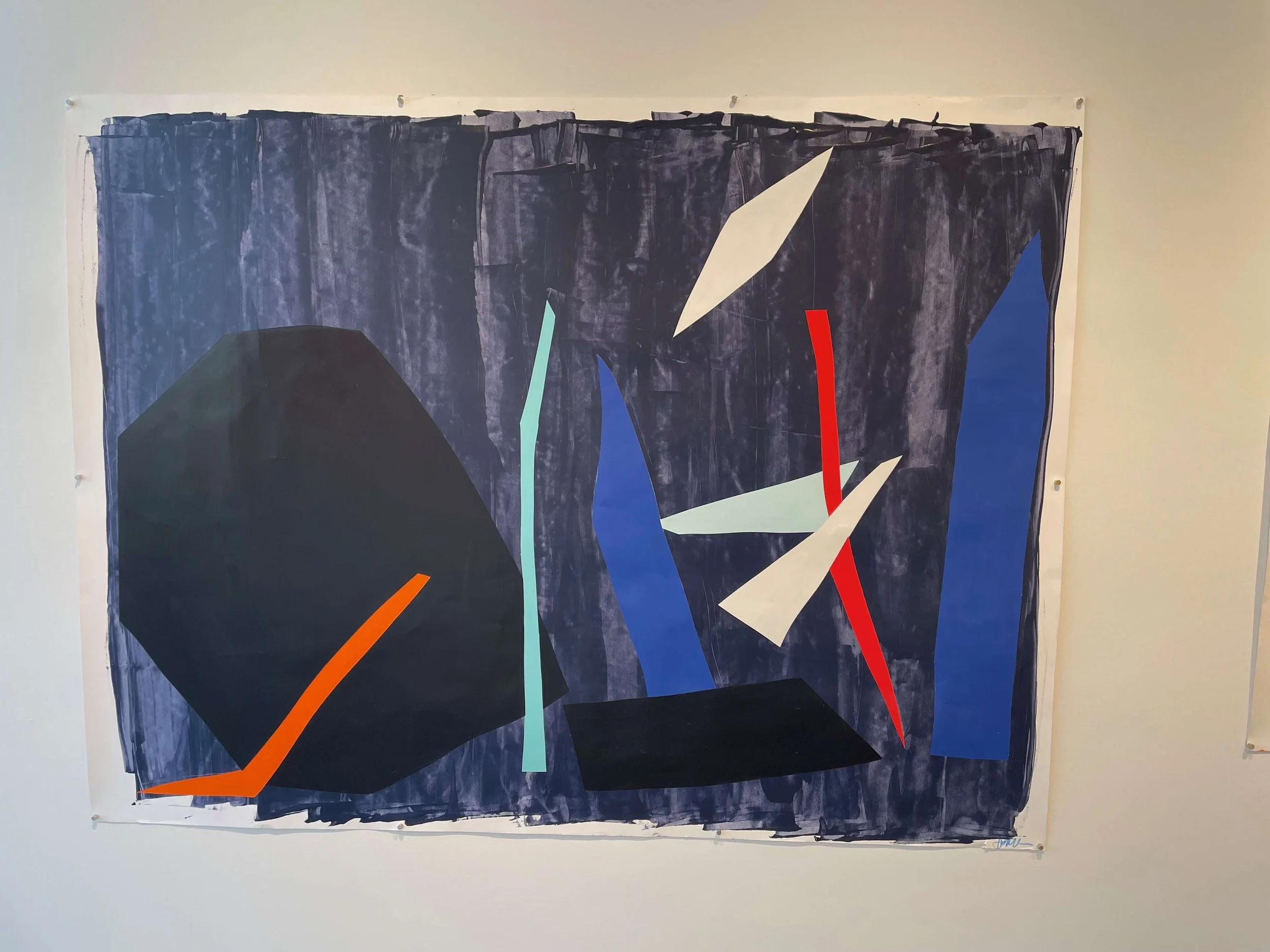 Abstract artwork with geometric shapes in black, blue, white, red, orange, and teal, on a dark blue painted background.