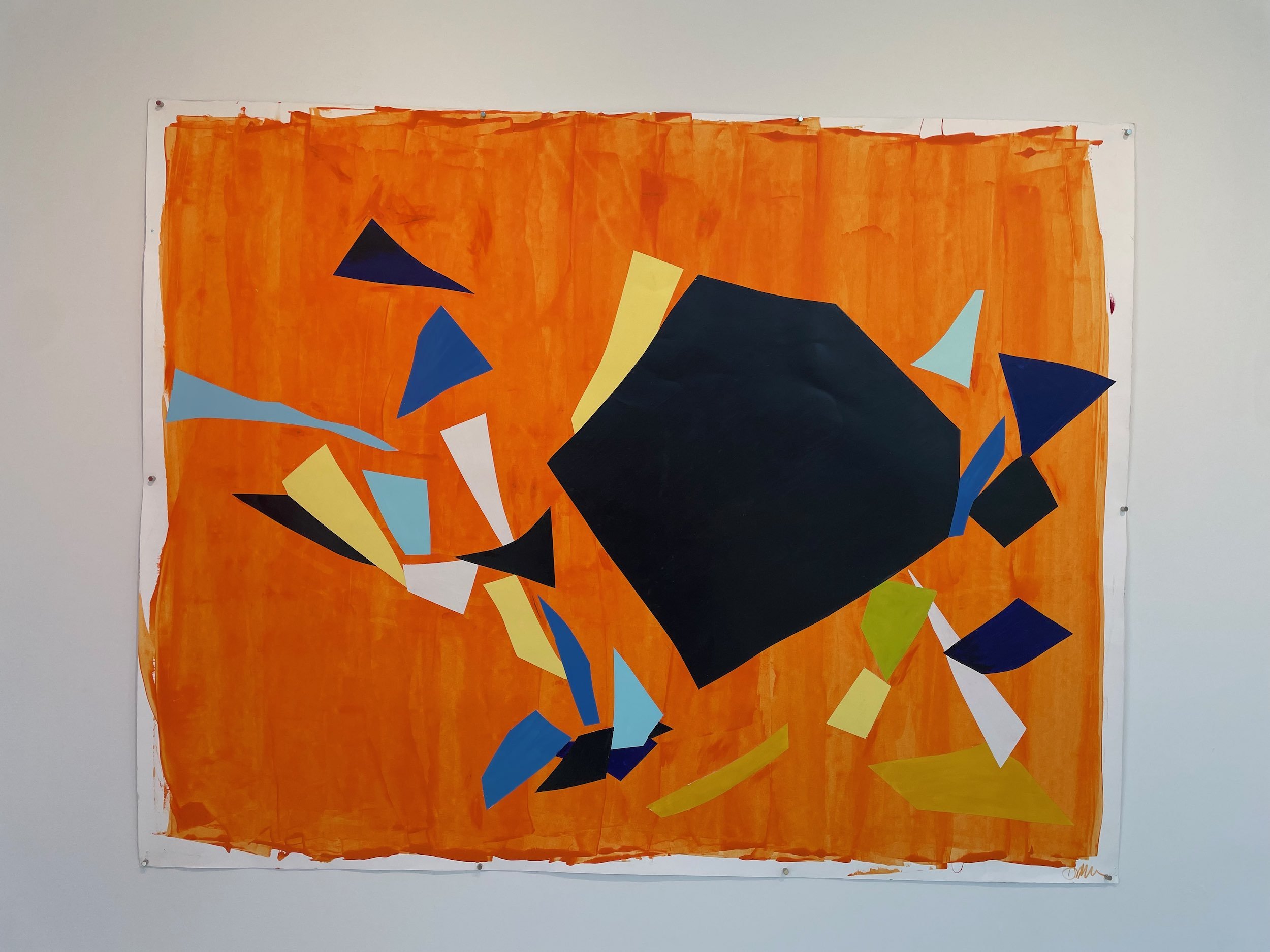 Abstract collage art with torn paper shapes in black, blue, yellow, white, and green on an orange background.
