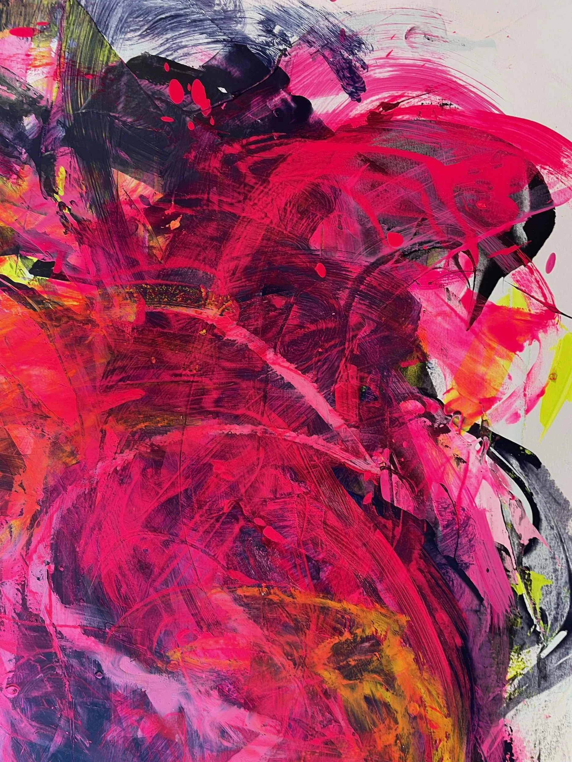 Abstract painting with bold strokes of pink, black, yellow, and orange paint on a canvas.