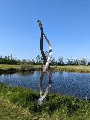 36. " Ancestral DNAIII" Stainless steel 140" x 22" Diameter. The sculpture rotates on a bearing. $25,000