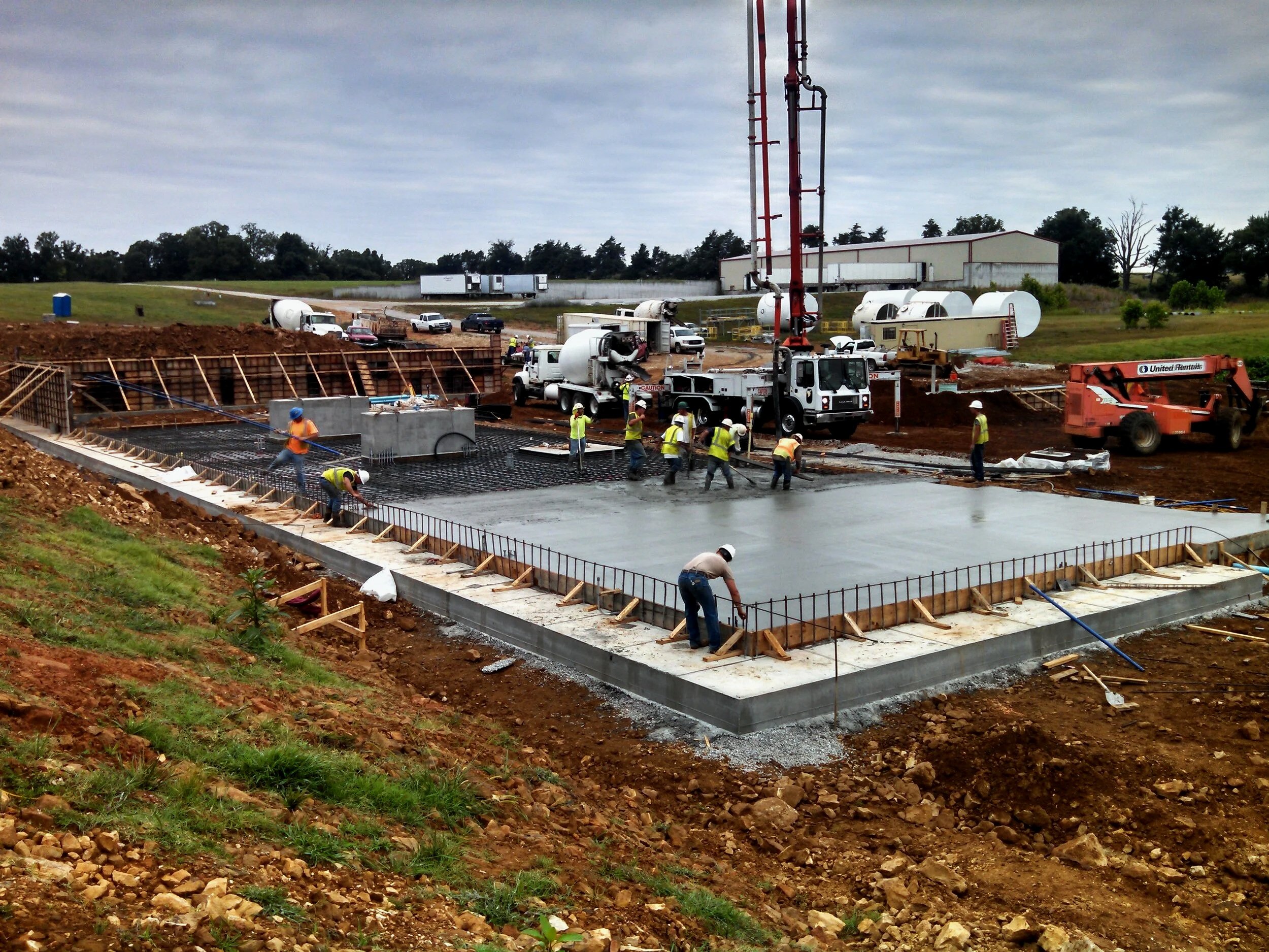 construction workers laying concrete foundation, bio-fuel plant construction, JL Bryson Inc.