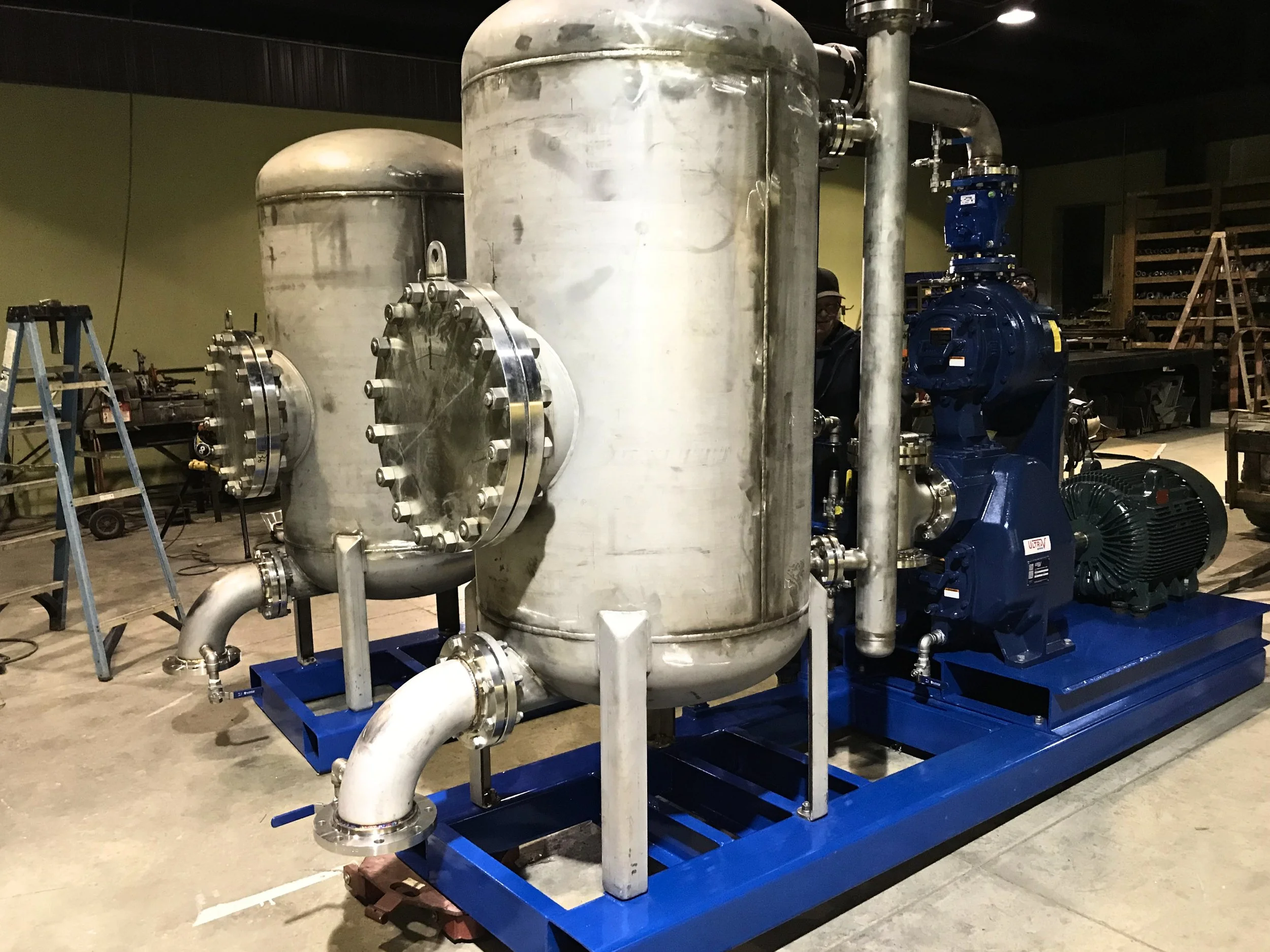 Custom blue and silver skid manufactured by JL Bryson Inc.
