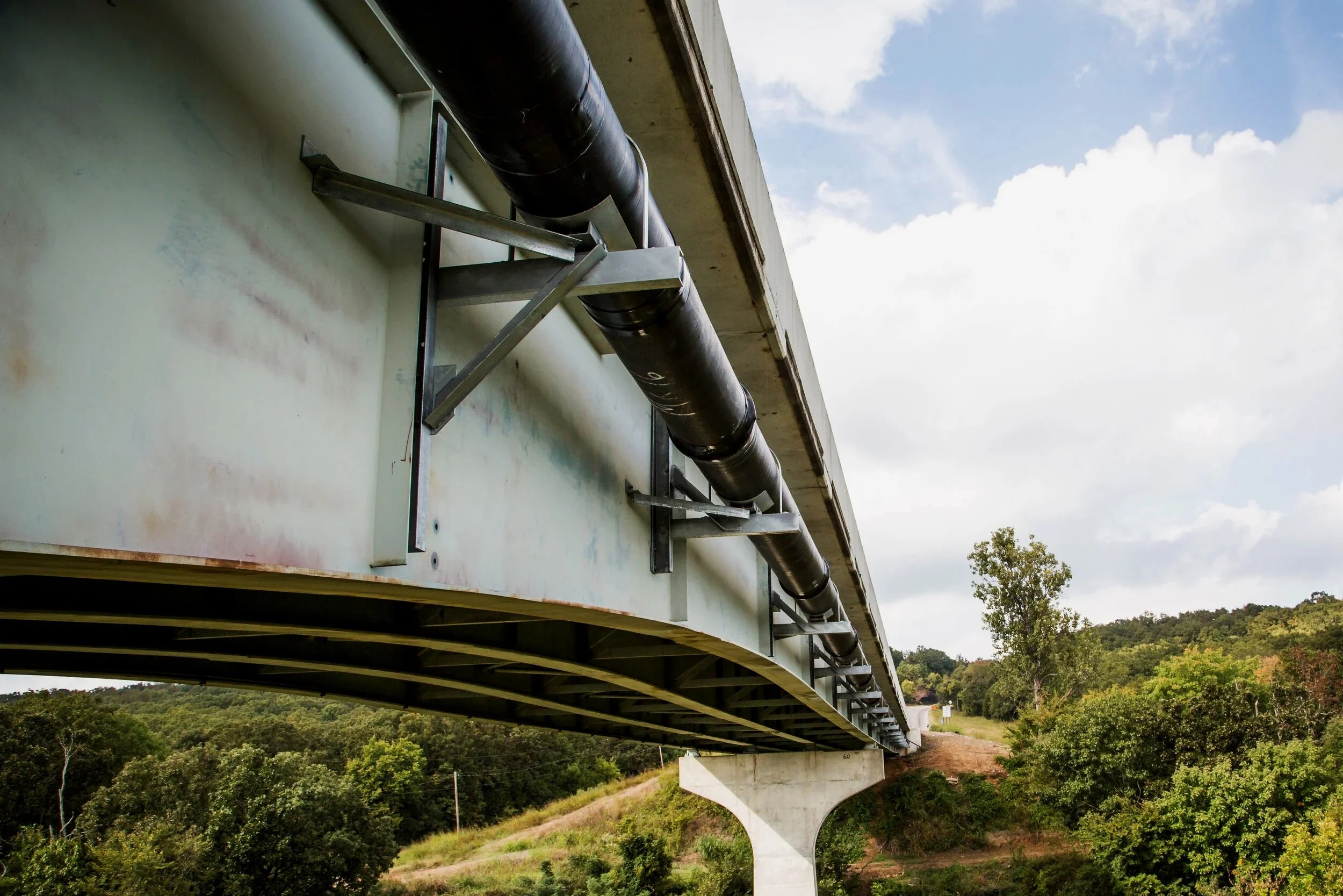 pipe work on bridge, under side of bridge, metal pipework, JL Bryson Inc.