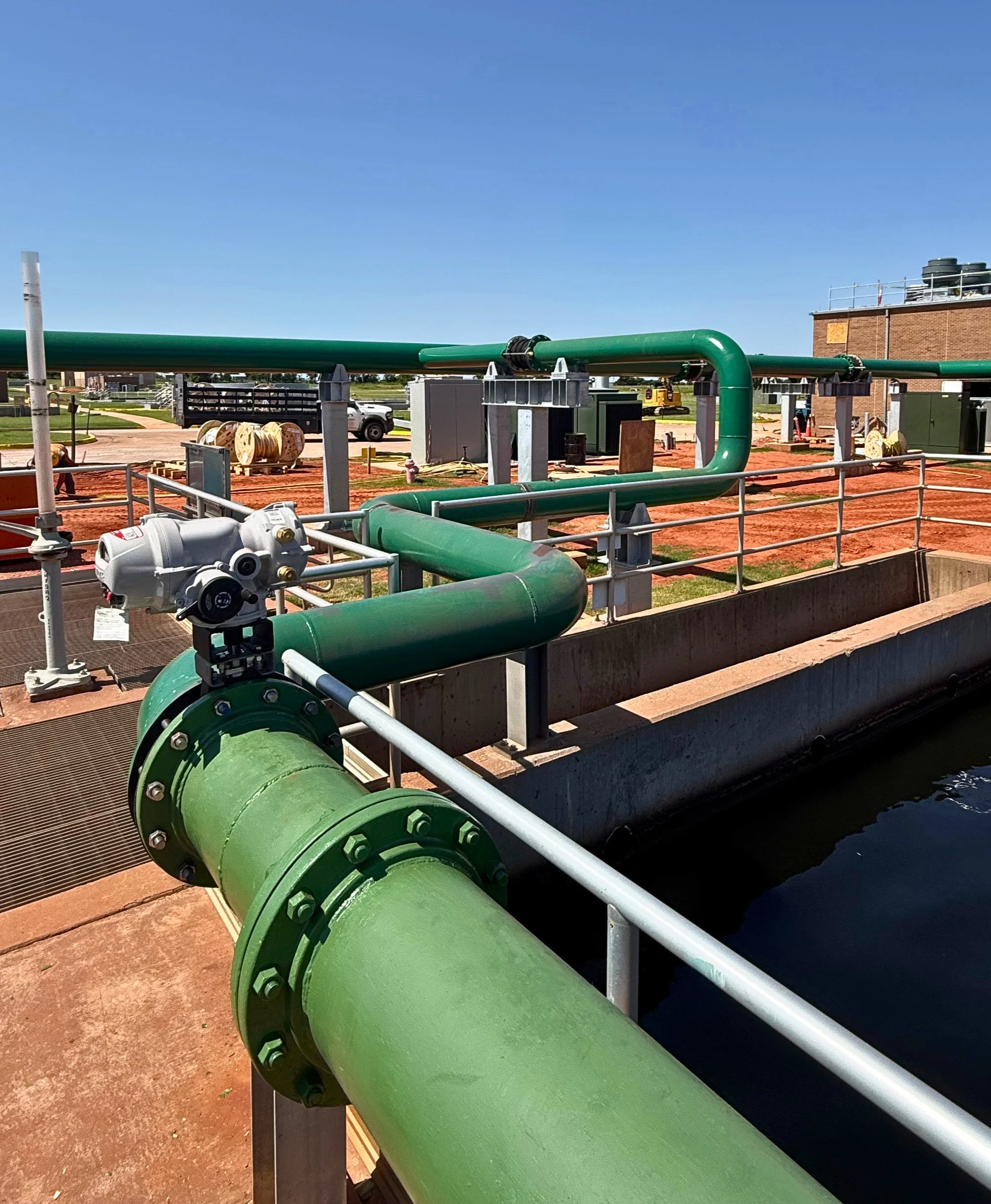 Deer Creek Wastewater Treatment Plant, JL Bryson Inc, green pipes, red dirt, railing