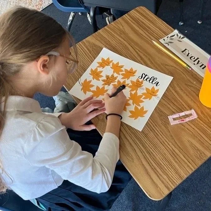 Our 3rd graders took part in a simple but memorable activity: each student wrote a word of encouragement on a paper leaf for a classmate. They read their leaves in quiet, and many were deeply moved by the kindness they received. One student shared, &