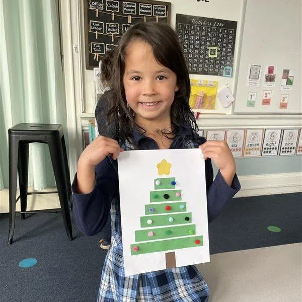 Kindergarten students learned about deciduous and coniferous trees, created geometric paper Christmas trees by arranging shapes in order, and began exploring Christmas around the world through Mexico&rsquo;s Las Posadas! 

Together, these lessons hel