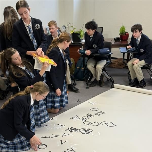 Logic students worked on a creative project integrating typography, Biblical text, and Latin translation to help visualize connections between history and the written word. Using the Trajan font, based on inscriptions from ancient Rome, they traced h