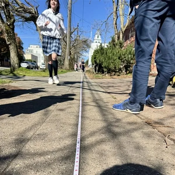 6th grade spent time racing outside as they learned about the Wright brothers and the invention of flight.

Students measured out 120 feet &mdash; the distance of the first flight &mdash; and timed themselves running it, comparing their speed to thos