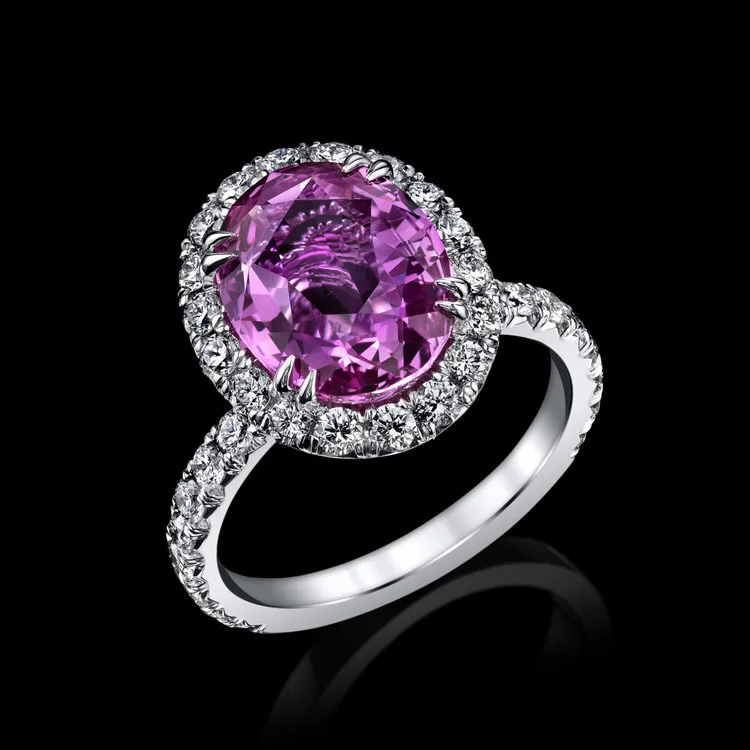 5ct-Pink-sapphire-set-in-a-diamond-halo-platinum-ring.jpg