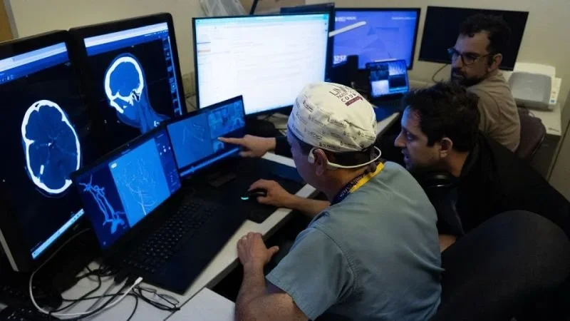Performing the first fully remote neuro-intervention. Dr. Vitor Mendes Pereira, Dr. David Bell, Adam Setapen