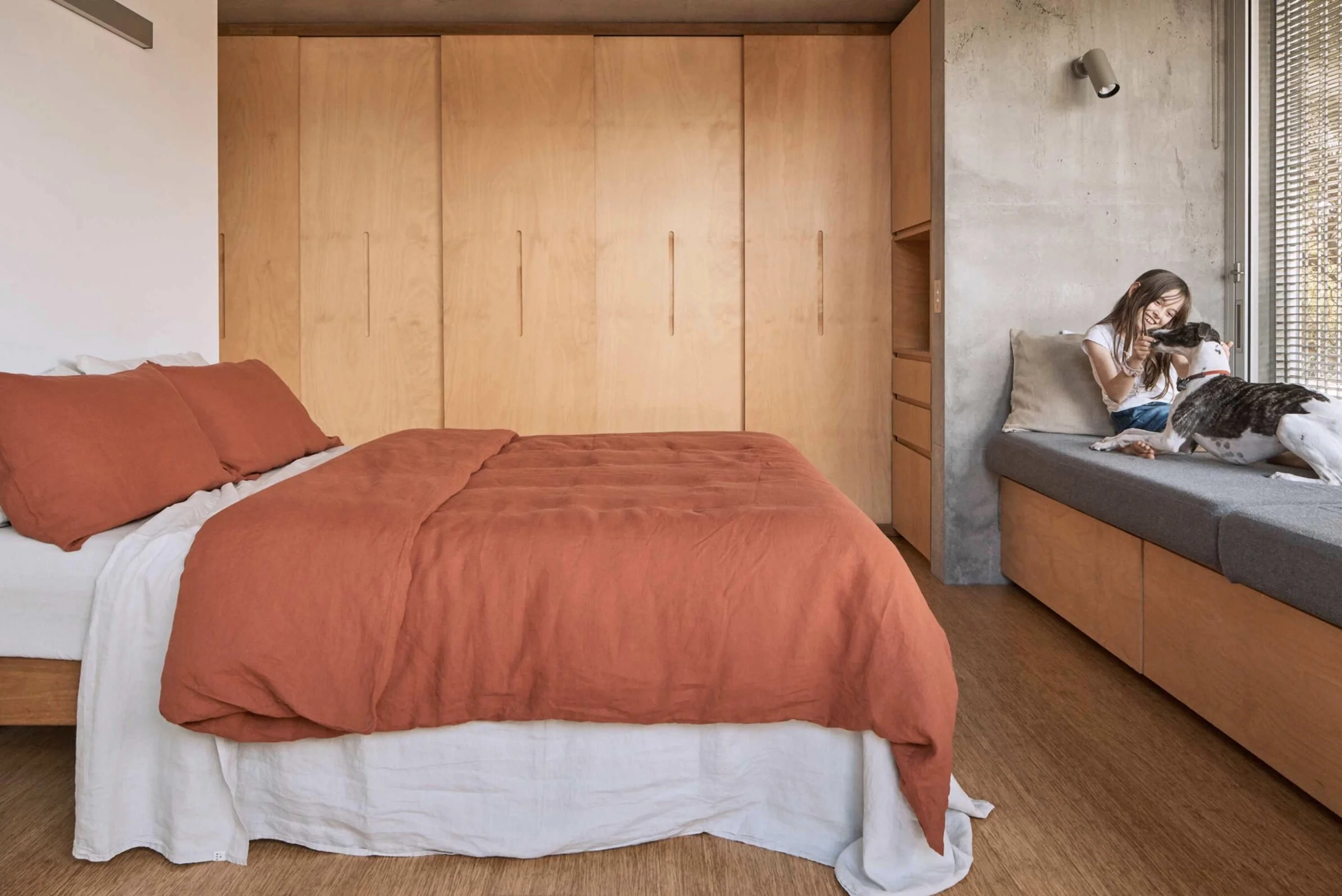 The queen bed is dressed in a duvet and pillowslips in the new season colour ‘brick’ paired back with a fitted sheet, flat sheet and pillowslips in dove grey.