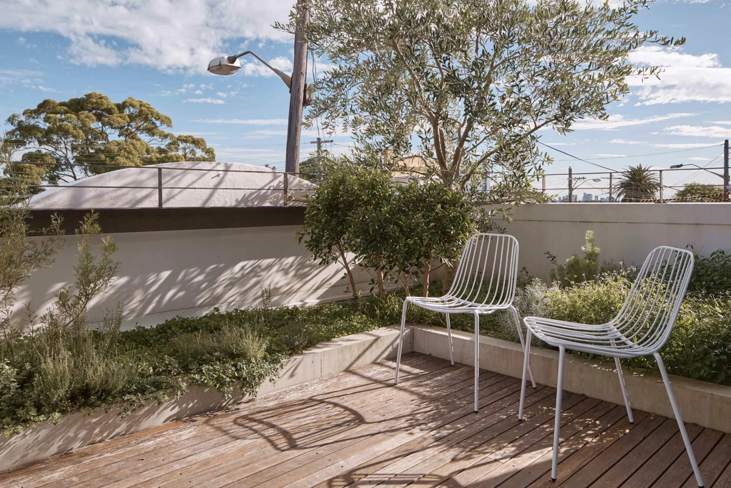 First floor roof terrace with chairs by m.a.d.