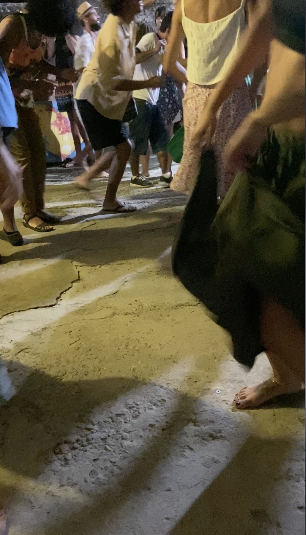  Figure 8. The floors are a poured concrete that has been laid and re-laid as the space has grown and changed. Often people feel comfortable dancing with bare feet. Belo Horizonte. Photograph by Lydia Collins, 2023. 