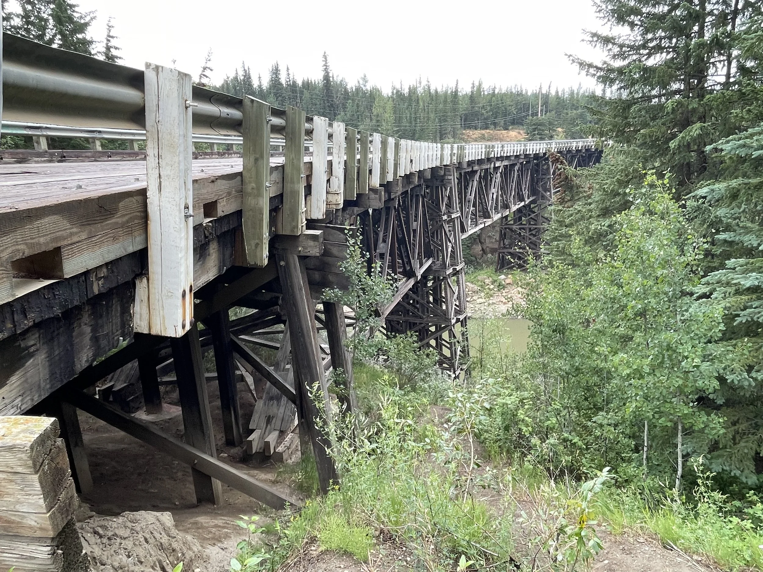 Figure 6. Tall piers tall piers support the curved truss bridge, hoisting it high above the Kiskatinaw River. Photograph by Desiree Valadares, 2023. 