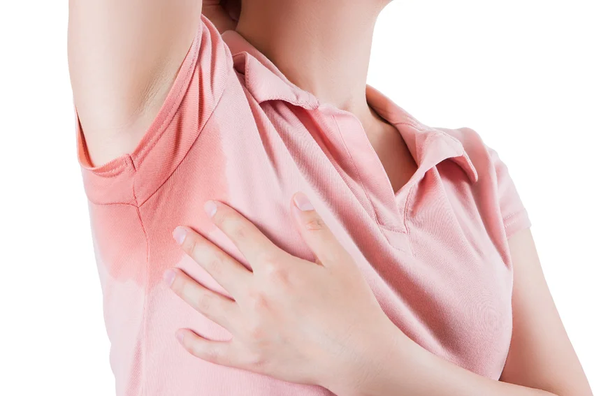 Photograph showing female experiencing excessive sweating.