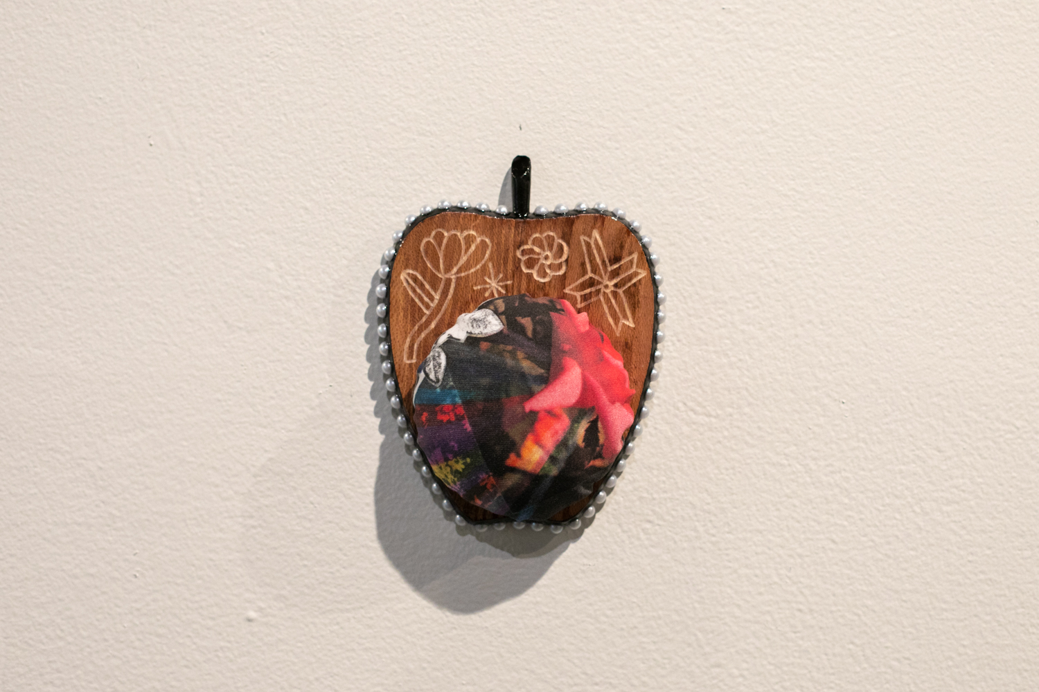  Apple Isle Pincushion, 2019, found wood coaster (engraved), handmade paper collage digitally printed on cotton sateen, plastic pearls, acrylic paint, resin.  Photography by Mel De Ruyter  