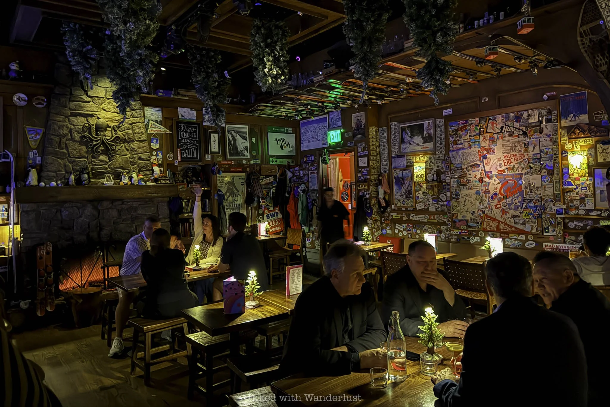 People in conversation at Ski Lodge speakeasy in Las Vegas.