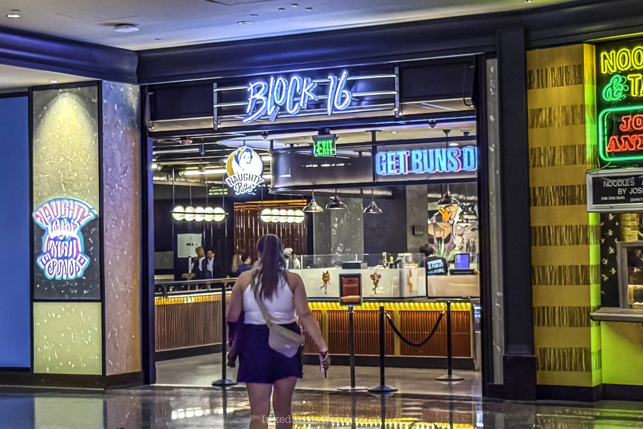 A person walking through Cosmopolitan Hotel on the way to Superfrico.