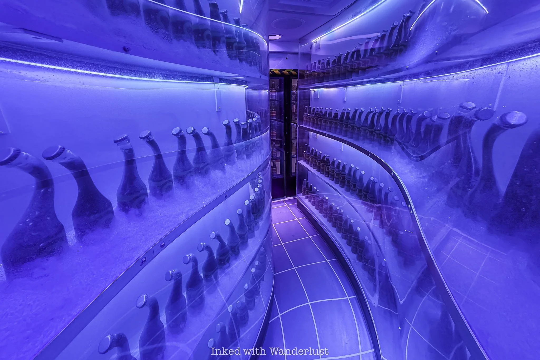 Walking through a hidden portal inside a cooler at Omega Mart Las Vegas.