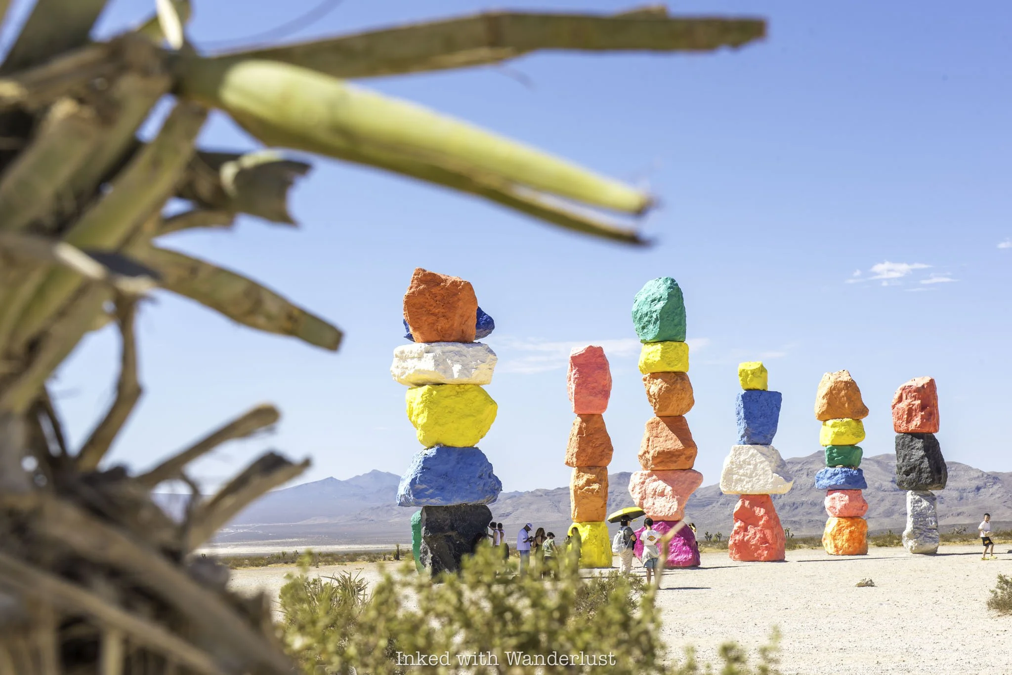 Seven Magic Mountains as viewed through desert sagebrush in Nevada.