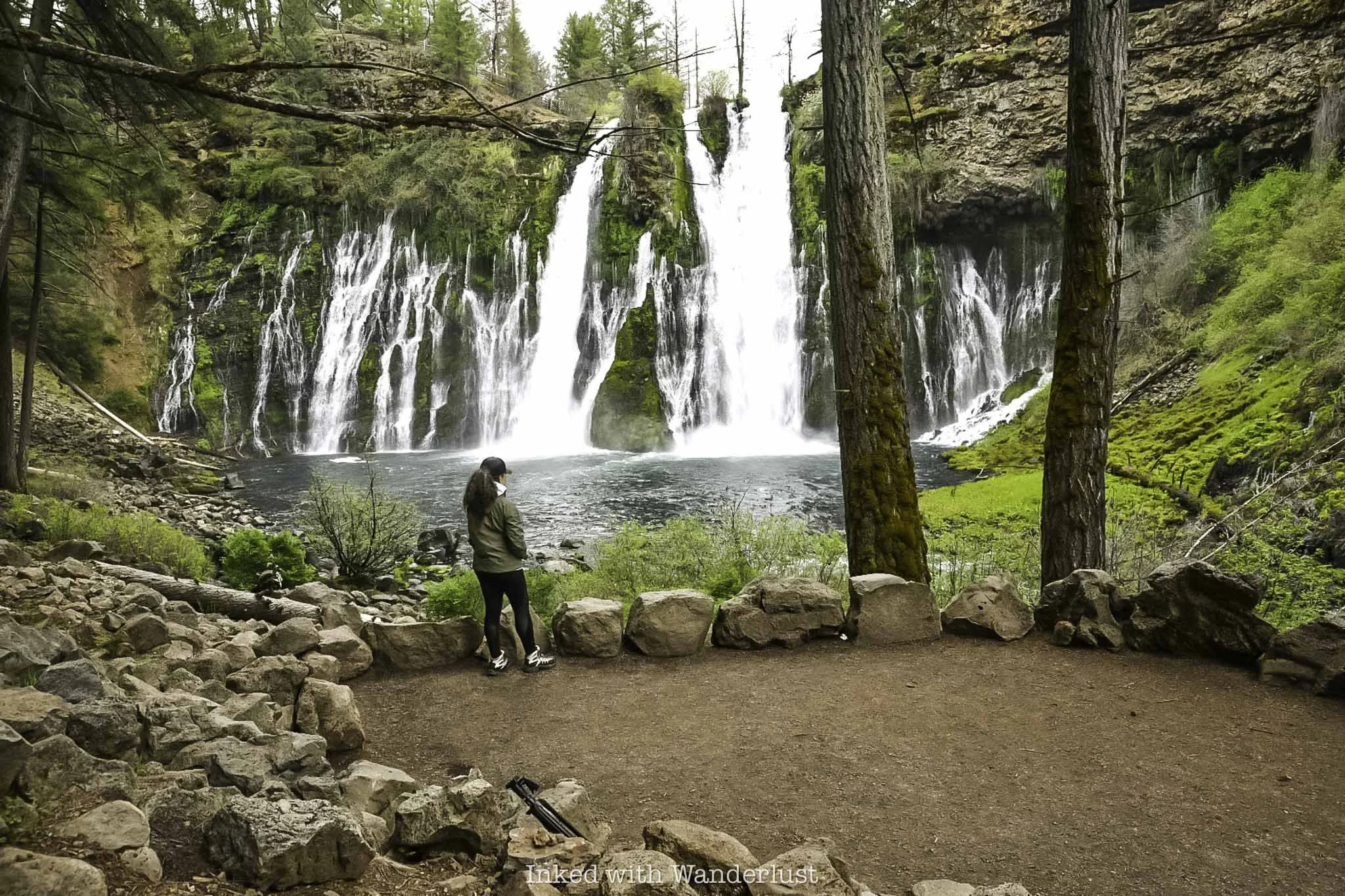 A person admiring Burney Falls from the lower viewing deck.